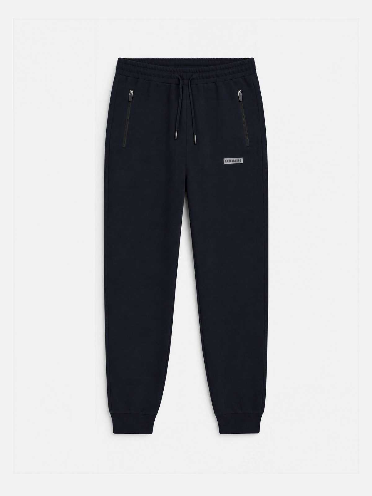 Front view of the Beyond the Bike sweatpants in dark navy, laid flat.