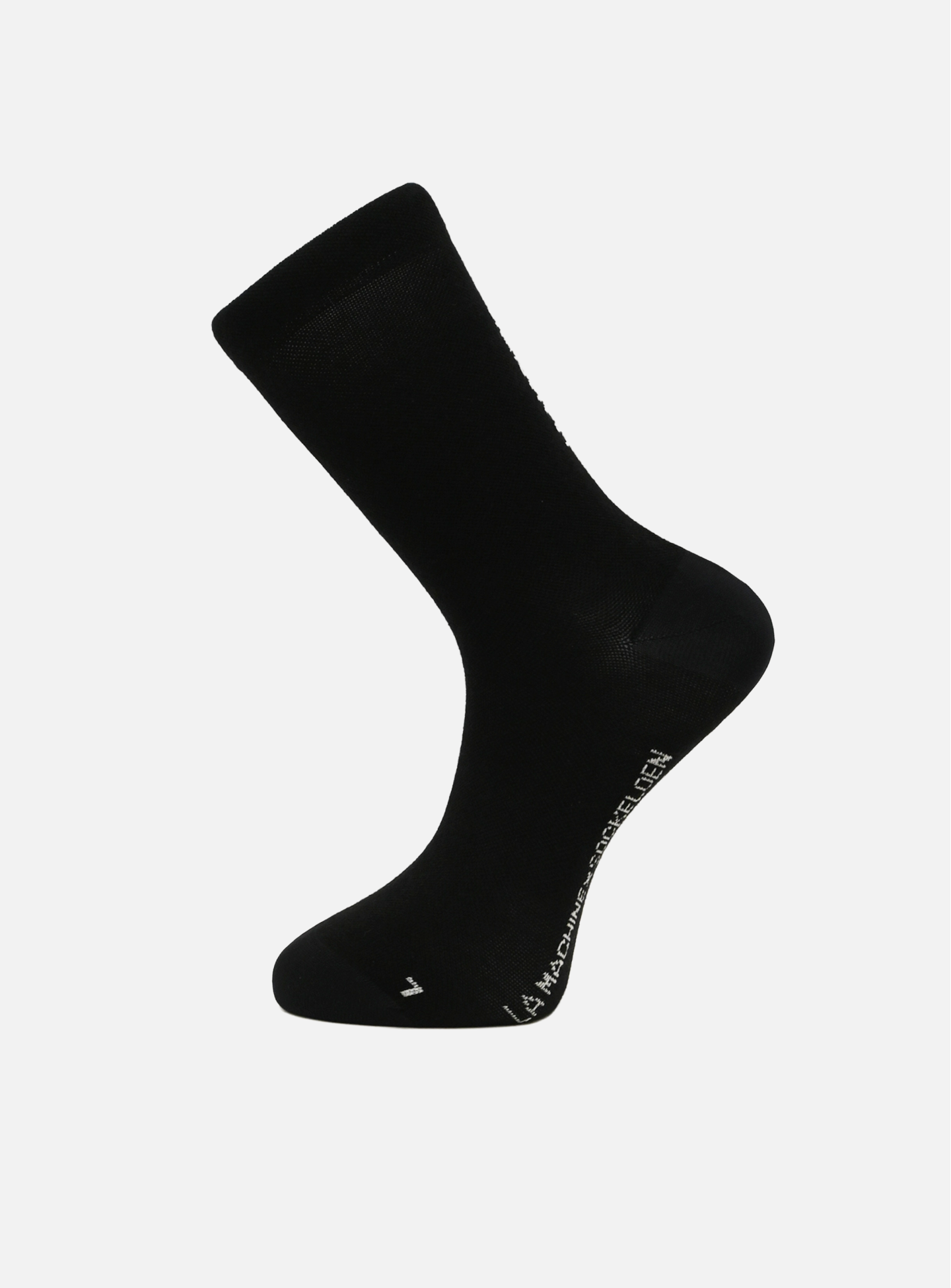 The La Machine Logo Cycling Sock in black merino, by La Machine Cycle Club, is shown against a white background to highlight the side and sole; unisex and ideal for versatile comfort with white logo text near the toe.