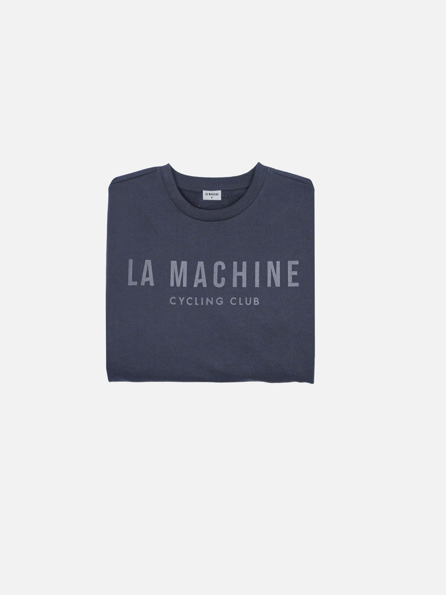 A navy La Machine Club Line sweatshirt from La Machine Cycle Club, featuring LA MACHINE CYCLING CLUB in light gray on the front, neatly folded and displayed against a plain white background.