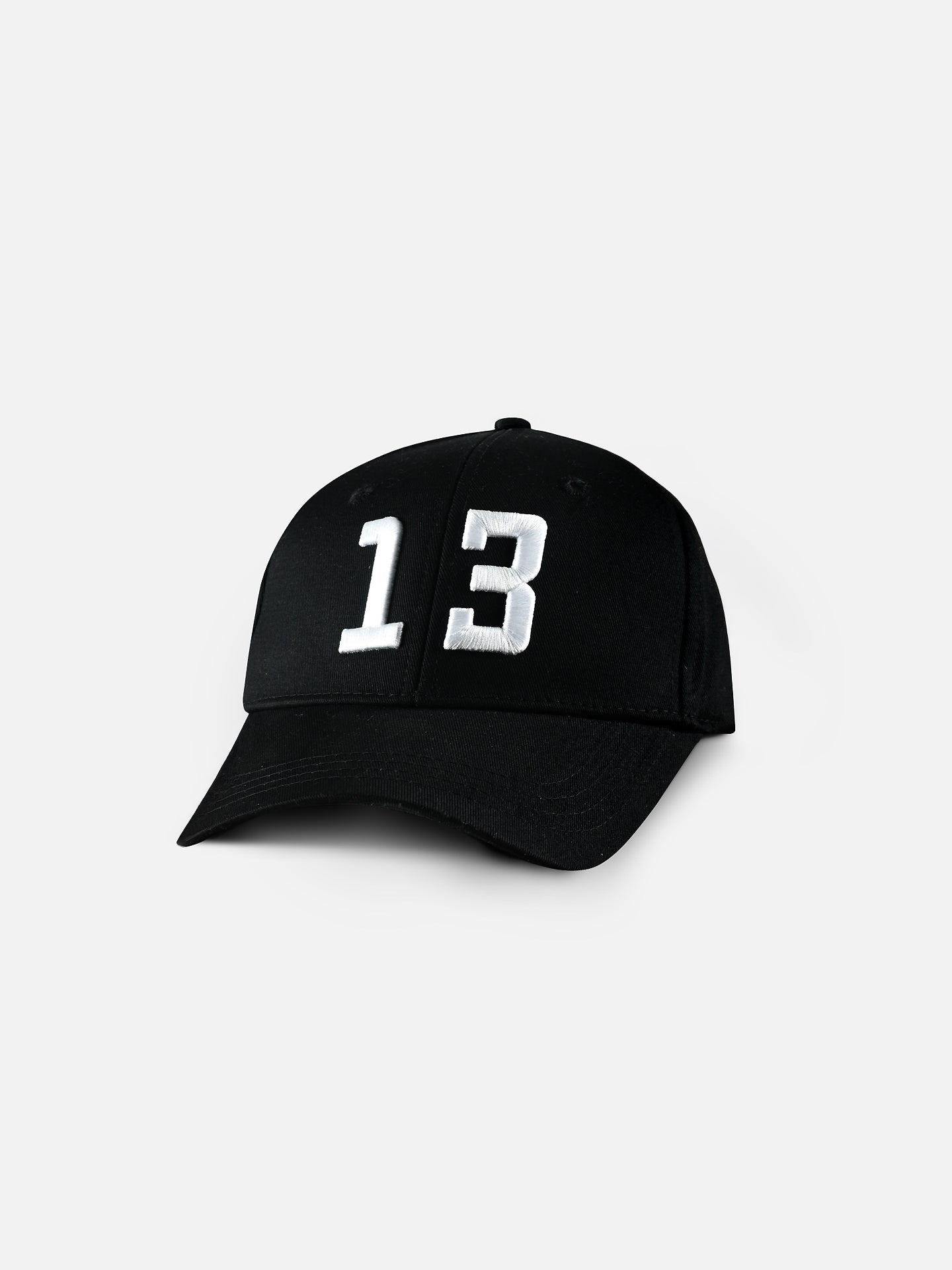 The 13 - Casual Cap by La Machine Cycle Club features a bold white number 13 embroidered on the front of its black design, shown against a plain white background—an ideal lucky cap for fans.
