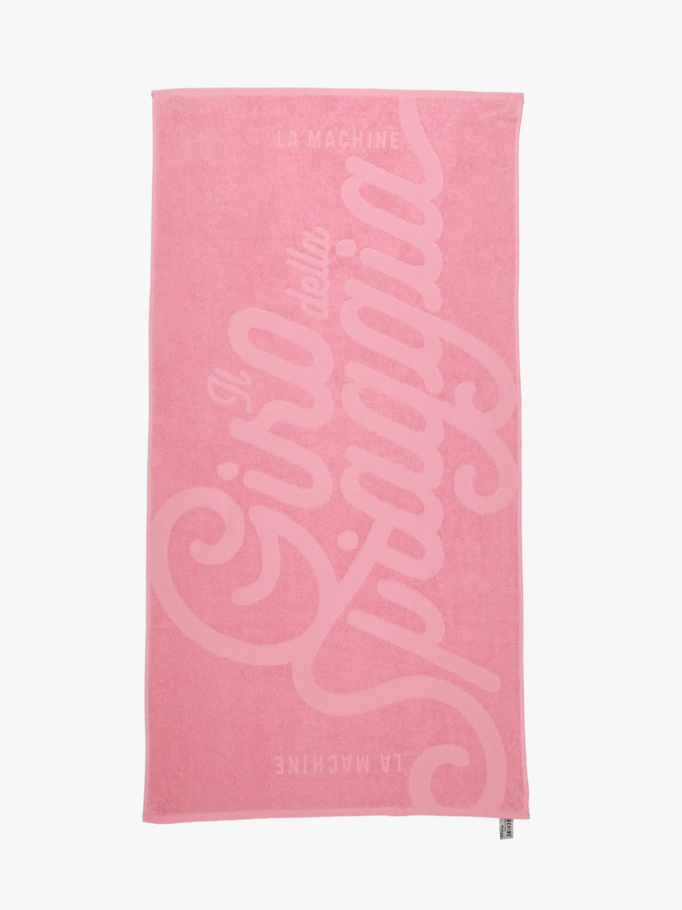 A pink 100% cotton beach towel by La Machine Cycle Club, featuring large cursive Il giro della spiaggia and La Machine details—perfect for fans of the Grand Tours - Towel Bundle.