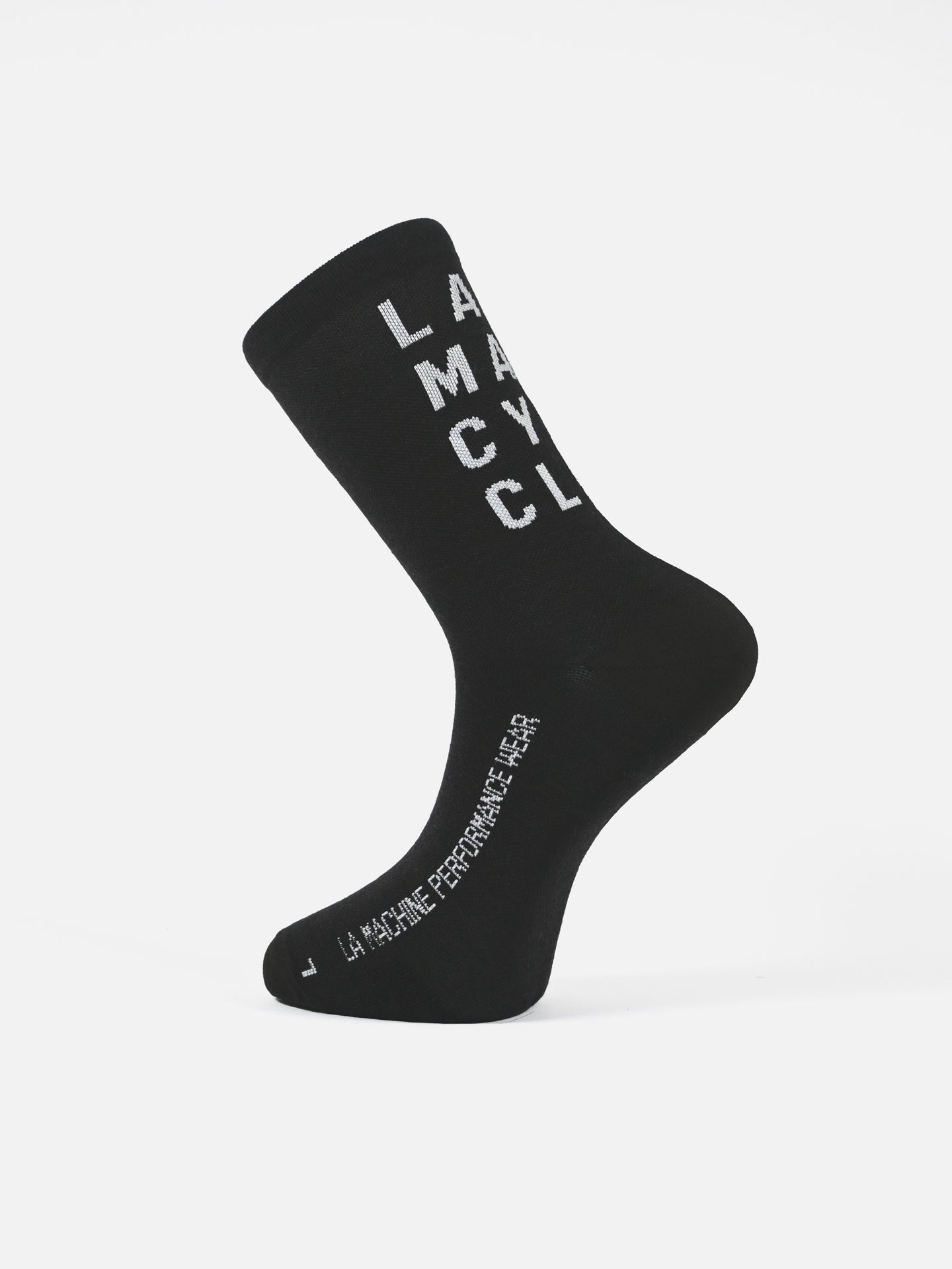 A single black La Machine Cycle Club unisex LMCC - Cycling Socks - Merino featuring white LAMCCYCL on the side and LA MACHINE PERFORMANCE WEAR on the foot, shown on a plain white background.