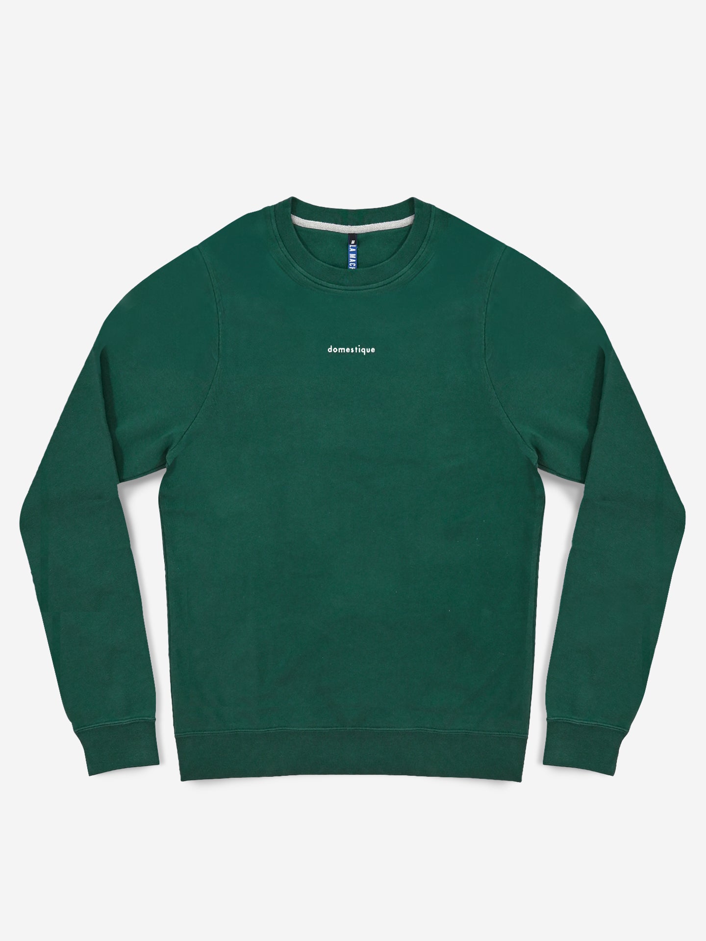 The Domestique - Sweatshirt by La Machine Cycle Club is a forest green men’s loose fit, long sleeve cycling sweatshirt with domestique in small white letters on the chest, shown against a plain white background.