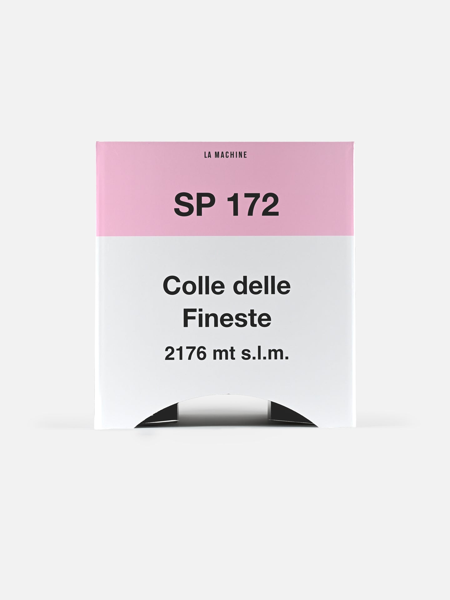 The Colle delle Finestre - 2-in-1 Stool & Sidetable (Misprint Edition) by La Machine Cycle Club features a pink and white box, ideal as cycling memorabilia or a unique foldable cardboard sidetable.