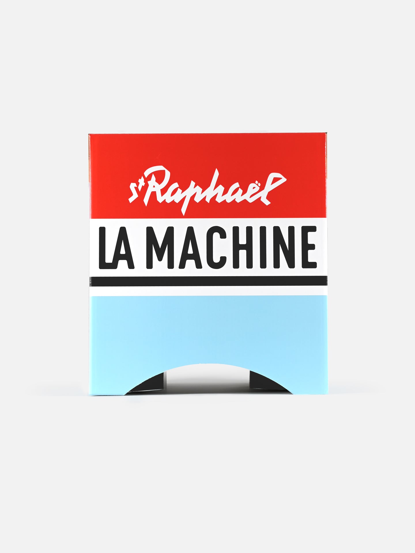 The St. Raphaël - 2-in-1 Stool & Sidetable by La Machine Cycle Club features a red top, white middle, and light blue bottom inspired by vintage team jerseys. St Raphaël appears in white script on red, with bold black LA MACHINE on the white strip.