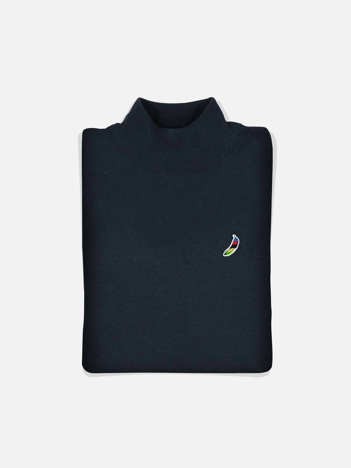 The La Machine Cycle Club Food of Champions knitted pullover features a small embroidered eggplant logo on the left chest and is displayed folded against a white background.