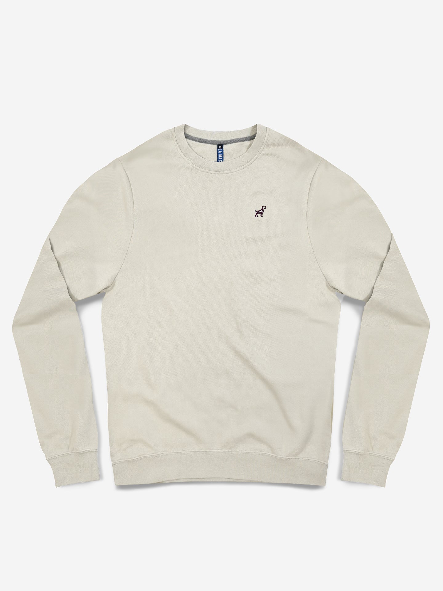 The La Machine Cycle Club G.O.A.T. Sweatshirt in Oyster Grey features long sleeves, ribbed cuffs and hem, and a small embroidered dog logo on the left chest, shown laid flat on a white background.