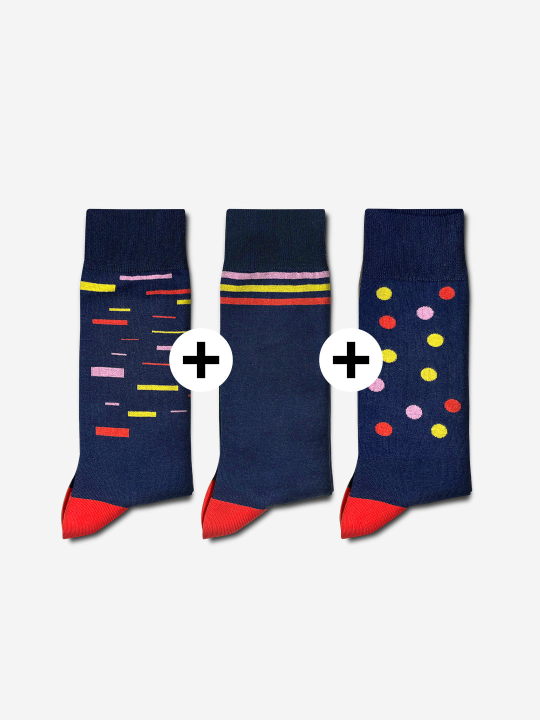 La Machine Cycle Clubs Grand Tours - Casual Socks - Bundle: three navy blue socks with red toes and heels—one with colorful rectangles, one striped in pink and yellow, one with colorful polka dots—a vibrant cycling set.