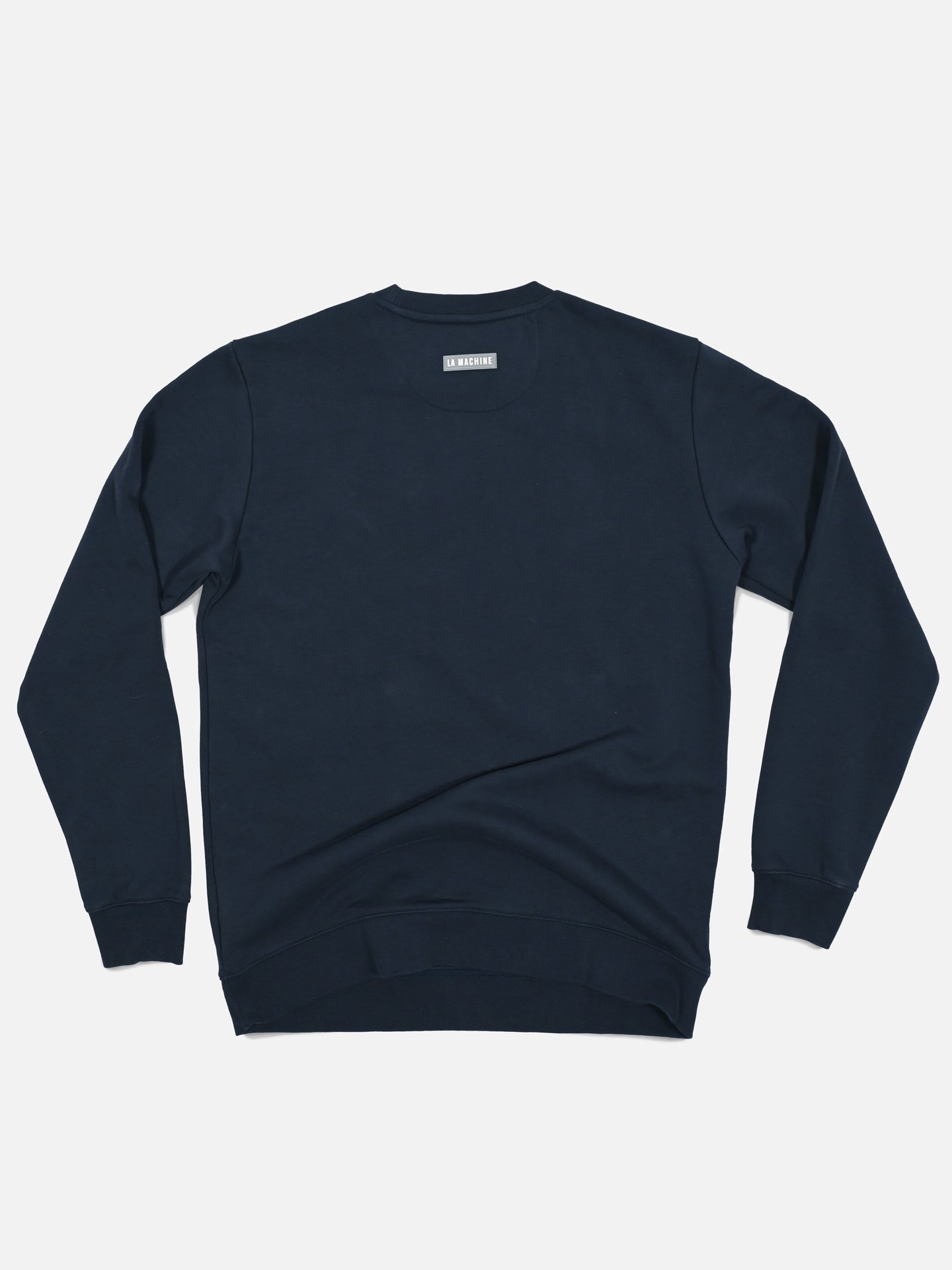 The Grand Tours III - Embroidered Sweatshirt by La Machine Cycle Club is a plain navy mens crewneck with ribbed cuffs and hem, shown from the back on a white background—ideal for subtle Grand Tour style fans.