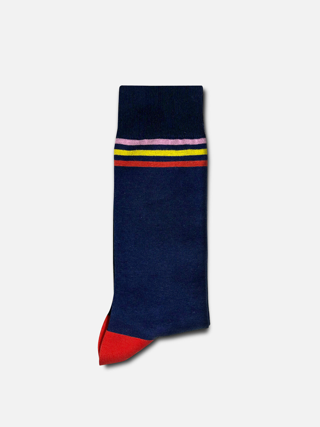 The Grand Tours - Trilogy Casual Sock by La Machine Cycle Club is a unisex navy blue sock with red toe and heel, multi-colored stripes near the top, inspired by Tour de France cycling socks. Displayed on a light gray background.