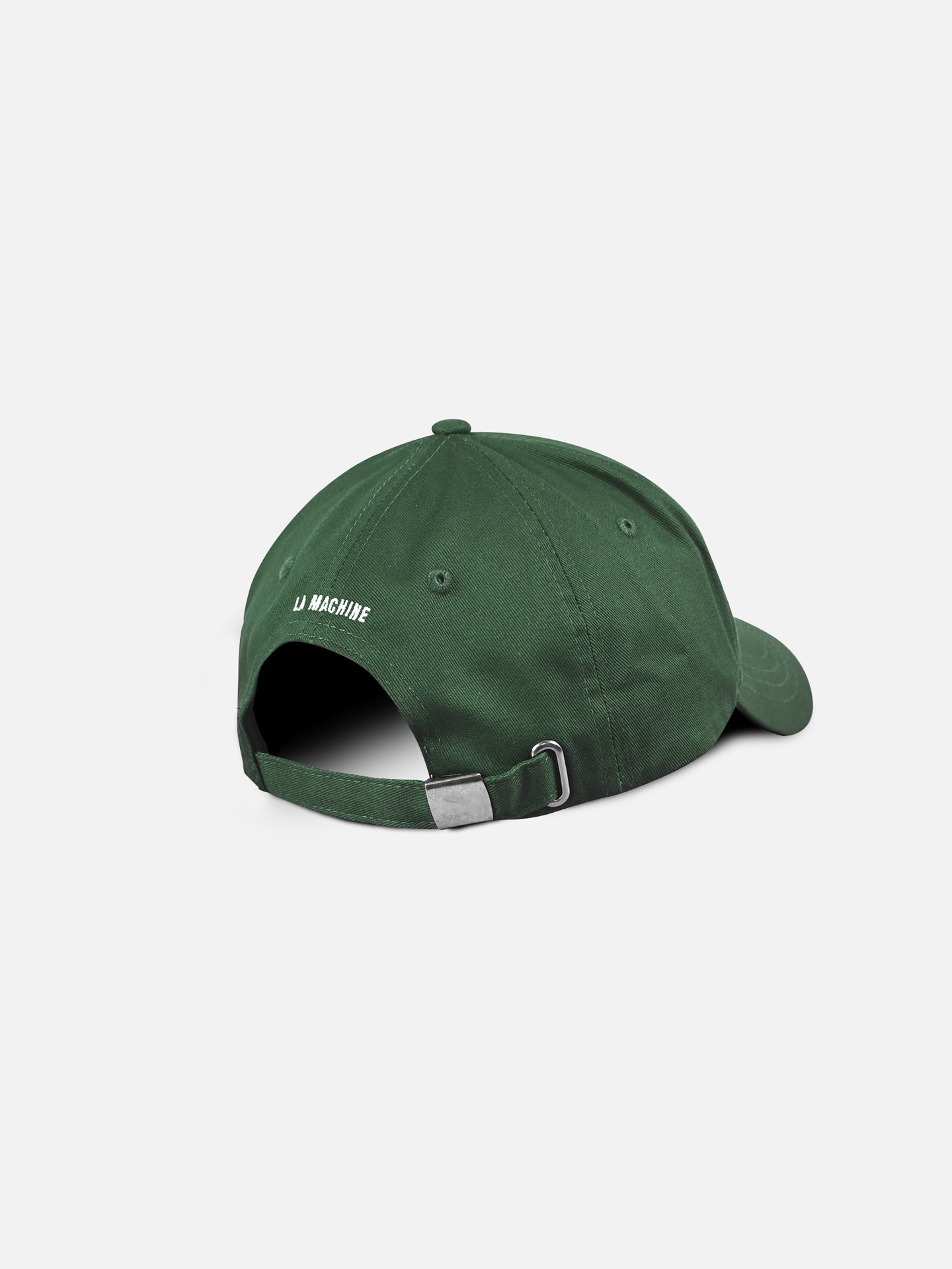 A dark green Suck at Skateboarding - Casual Cap by La Machine Cycle Club, shown from the back, features an adjustable strap with a metal buckle and white LA MACHINE embroidery near the opening.