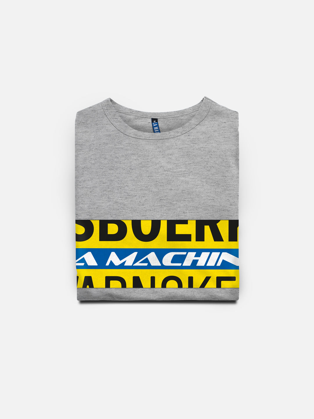 A folded gray unisex Ijsboerke - The Remix T-shirt by La Machine Cycle Club, made of 100% cotton, with bold yellow, blue, and black text partially visible on the front, shown against a plain white background.