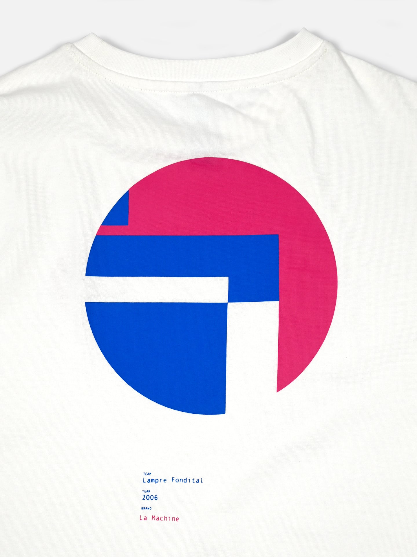 The Lampre Fondital 06 Loose Fit T-shirt by La Machine Cycle Club is a white tee with a large circular pink and blue graphic on the back and Lampre Fondital 2006 La Machine text—ideal for vintage cycling jersey fans.