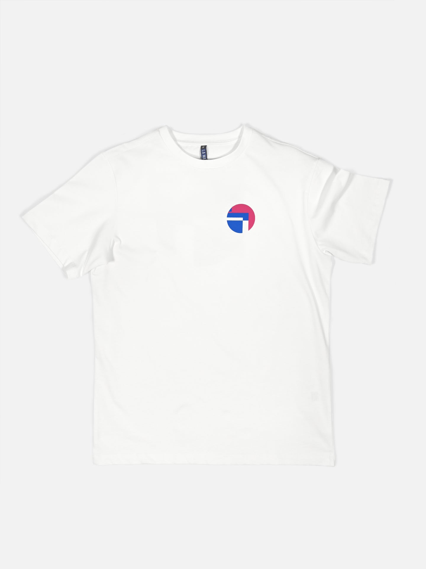 The Lampre Fondital 06 - Loose Fit T-shirt by La Machine Cycle Club is a plain white tee with a small, round blue, pink, and white logo on the left chest, inspired by classic Lampre Fondital cycling jersey colors. Shirt shown flat on white background.
