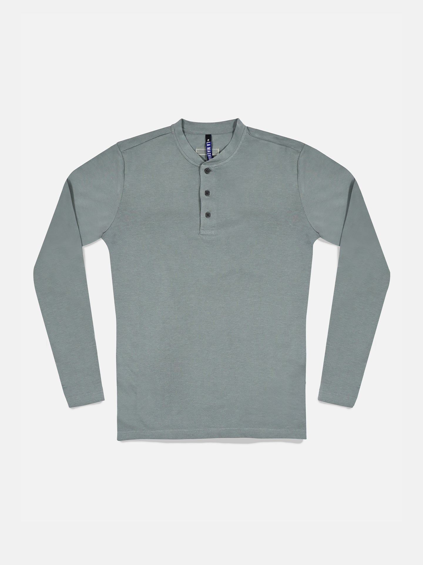 The Le Pavé Henley in Roubaix Blue by La Machine Cycle Club features long sleeves, a round collar, and a three-button placket in soft heavy cotton, displayed flat on a white background.