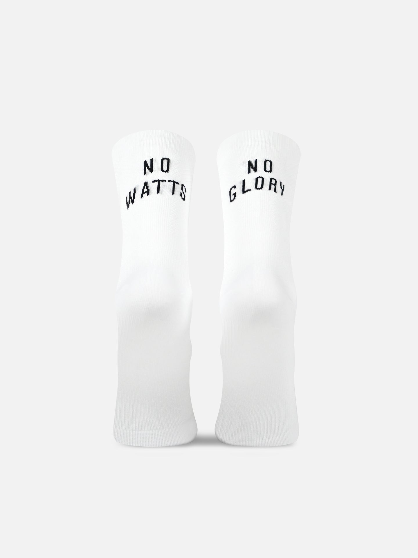 The La Machine Cycle Club’s No Watts No Glory - Cycling Socks in white are shown upright on a light gray background. The left sock reads NO WATTS and the right NO GLORY in black text, featuring a seamless toe for comfort.