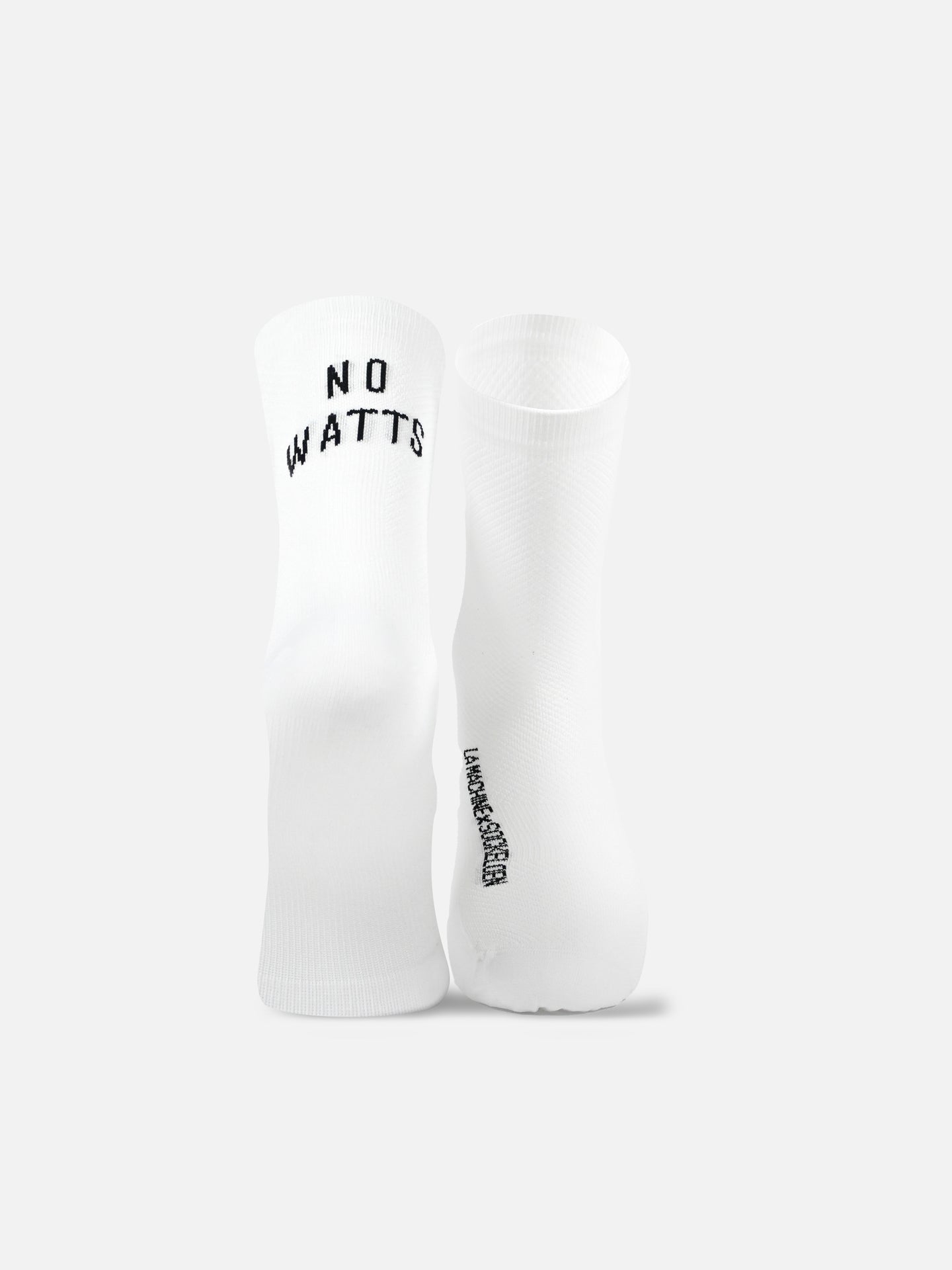 La Machine Cycle Club’s No Watts No Glory - Cycling Socks in white are shown upright. One sock features NO WATTS in black on top, the other has text along the sole. Seamless toe construction provides comfort. Background is plain light gray.