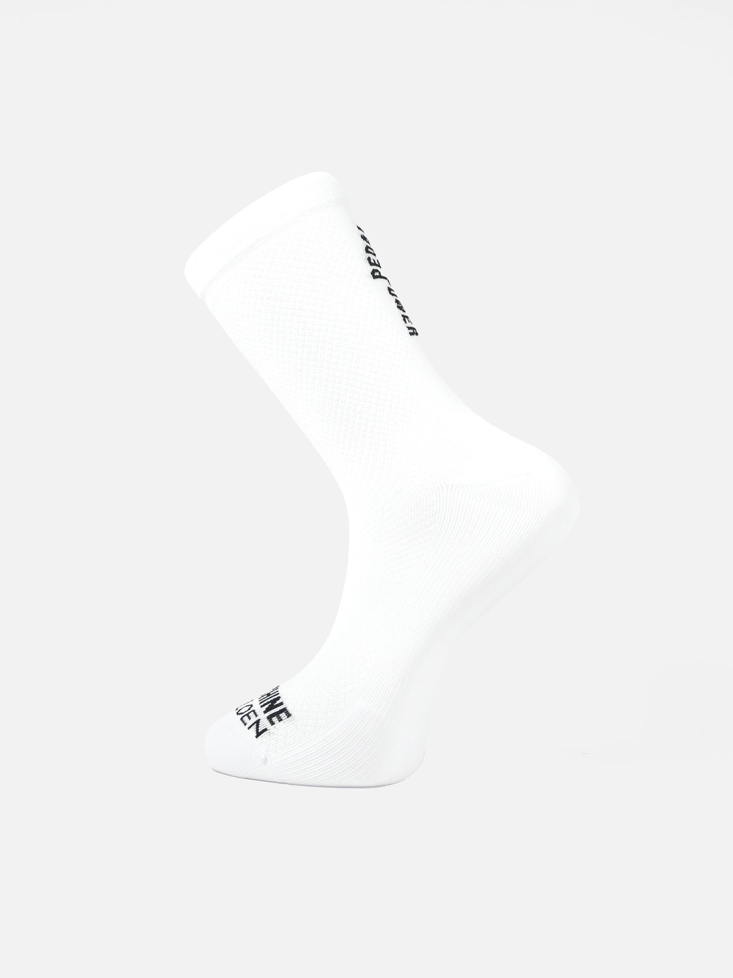 The Pedal Power - Cycling Socks in white by La Machine Cycle Club are shown on a foot form, angled to display side and sole. Black branding appears near the ankle and toe. Designed for optimal elastic fit and comfort, set against a plain white background.