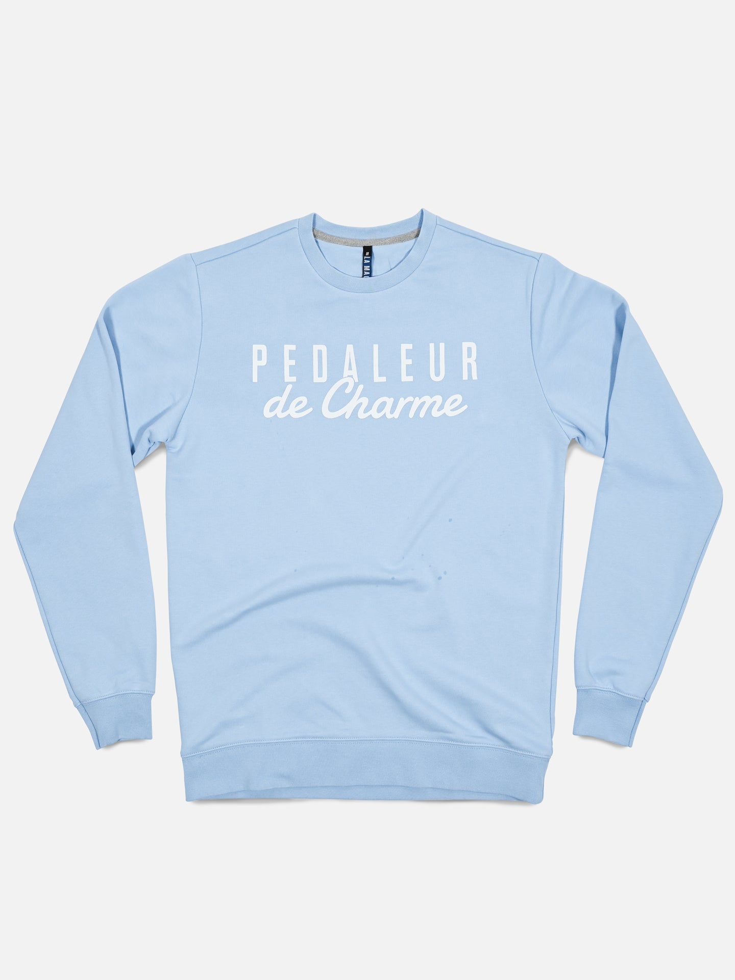 La Machine Cycle Club’s Pedaleur de Charme - Sweatshirt in light blue features PEDALEUR de Charme in white, inspired by Giro d’Italia winner Hugo Koblet, shown flat on a white background.