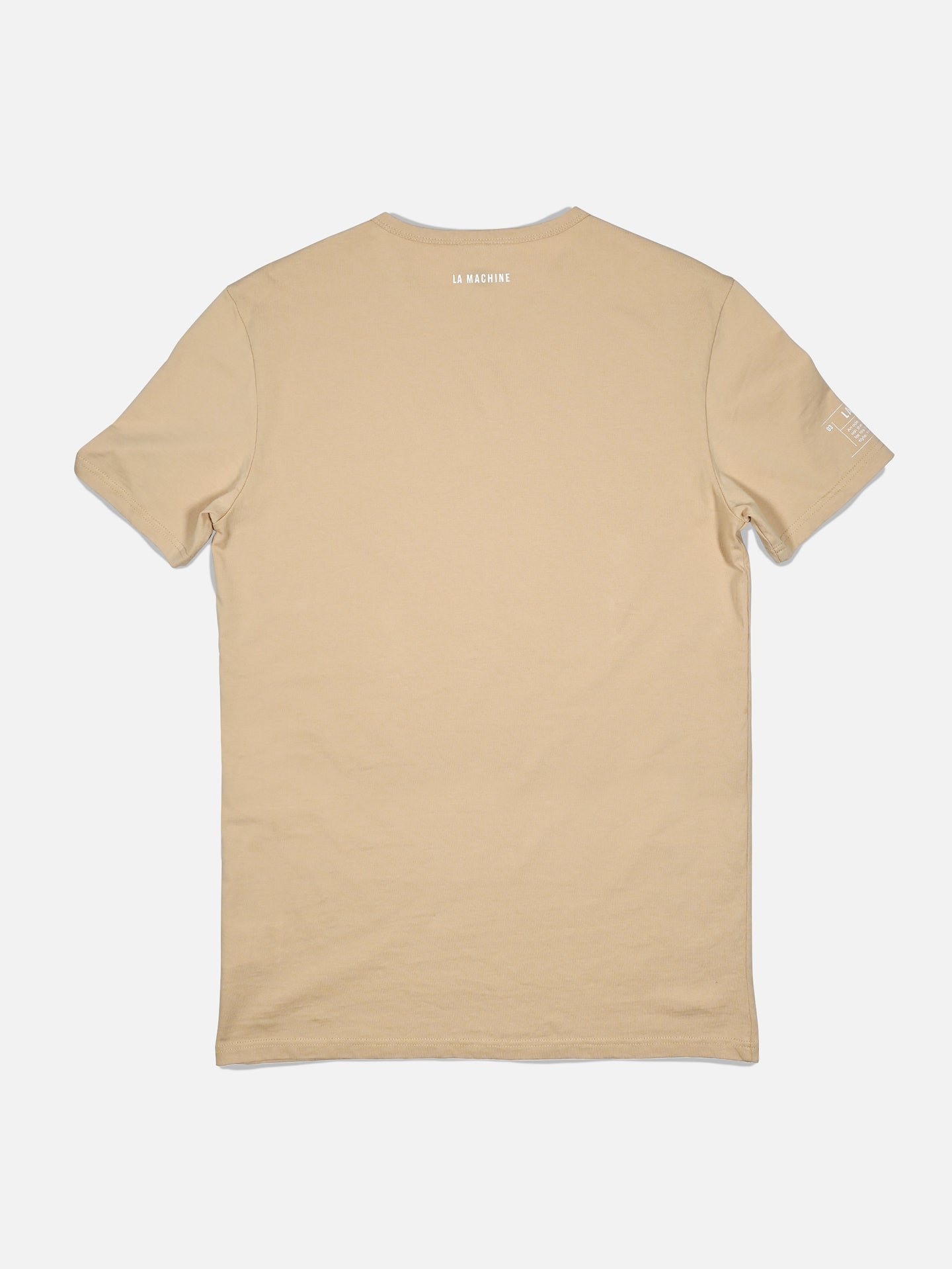 A sand-colored unisex cotton t-shirt by La Machine Cycle Club, Pedaleur de Charme, shown flat from the back with small white text near the neckline and a left sleeve logo—a subtle Giro d’Italia tribute.
