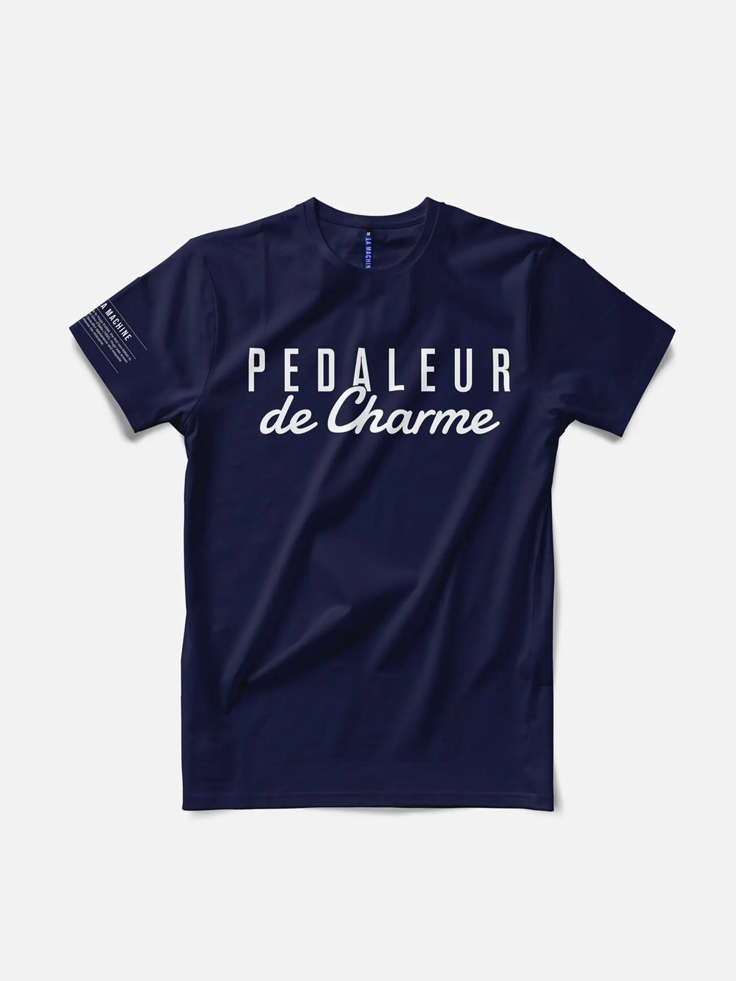 The Pedaleur de Charme - T-shirt - Navy by La Machine Cycle Club features white French text PEDALEUR de Charme on the front, honoring Giro d’Italia winner Hugo Koblet’s classic style. Mens premium cycling tee shown flat on a white background.