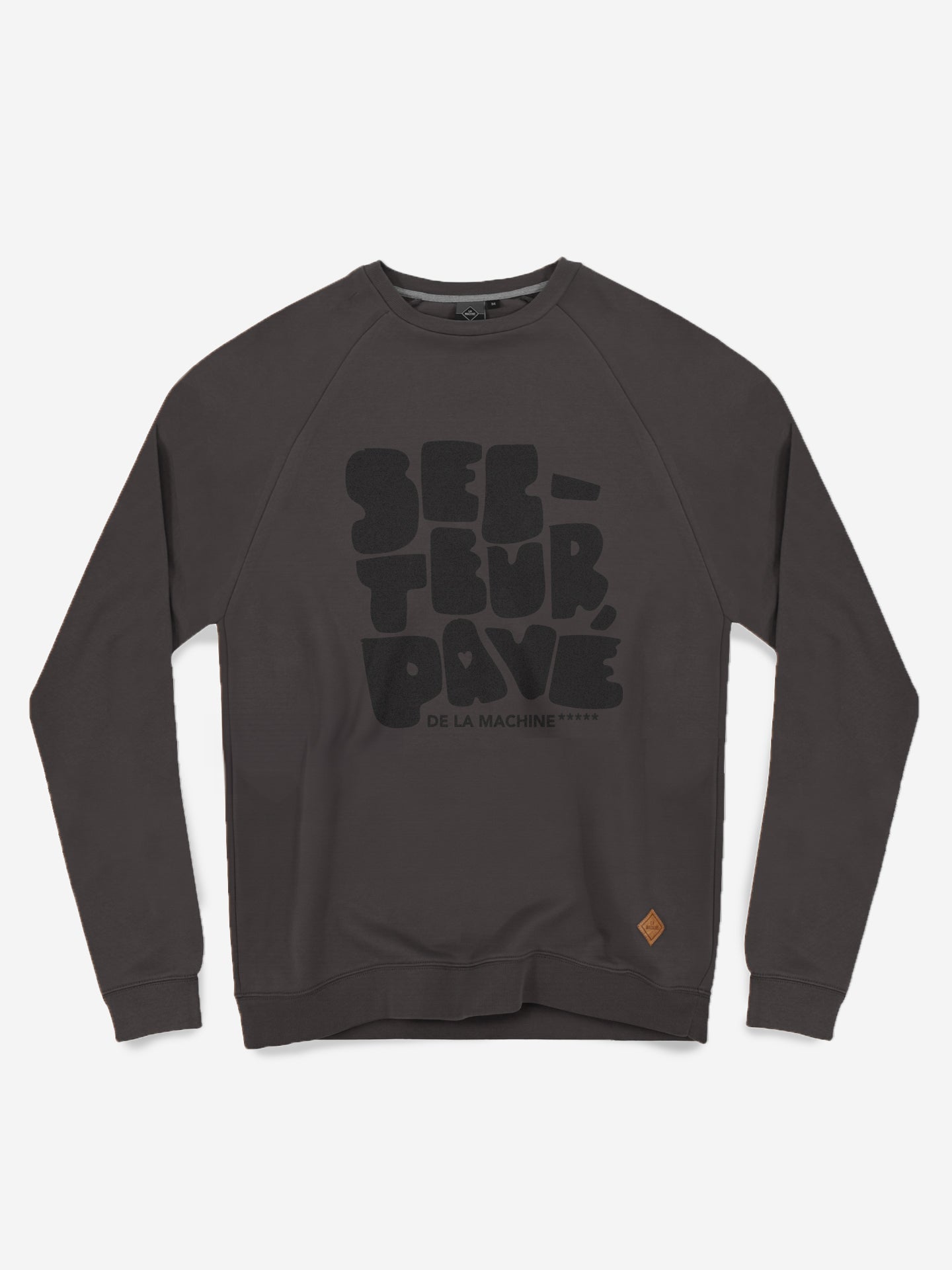 The Secteur Pavé - Sweatshirt by La Machine Cycle Club is a dark gray mens sweatshirt featuring bold black SECTEUR, RAVÉ DE LA MACHINE text on the front and a small brown patch near the lower left hem. Inspired by Paris-Roubaix.