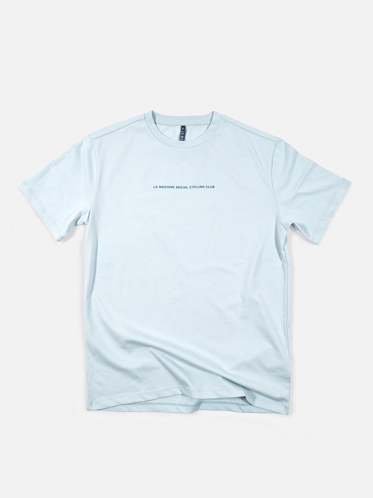 The La Machine Cycle Club Social Cycling Club - Loose Fit T-shirt in light blue heavy cotton features LA MACHINE SOCIAL CYCLING CLUB in small black letters on the chest and a large back print, shown flat on a white background.