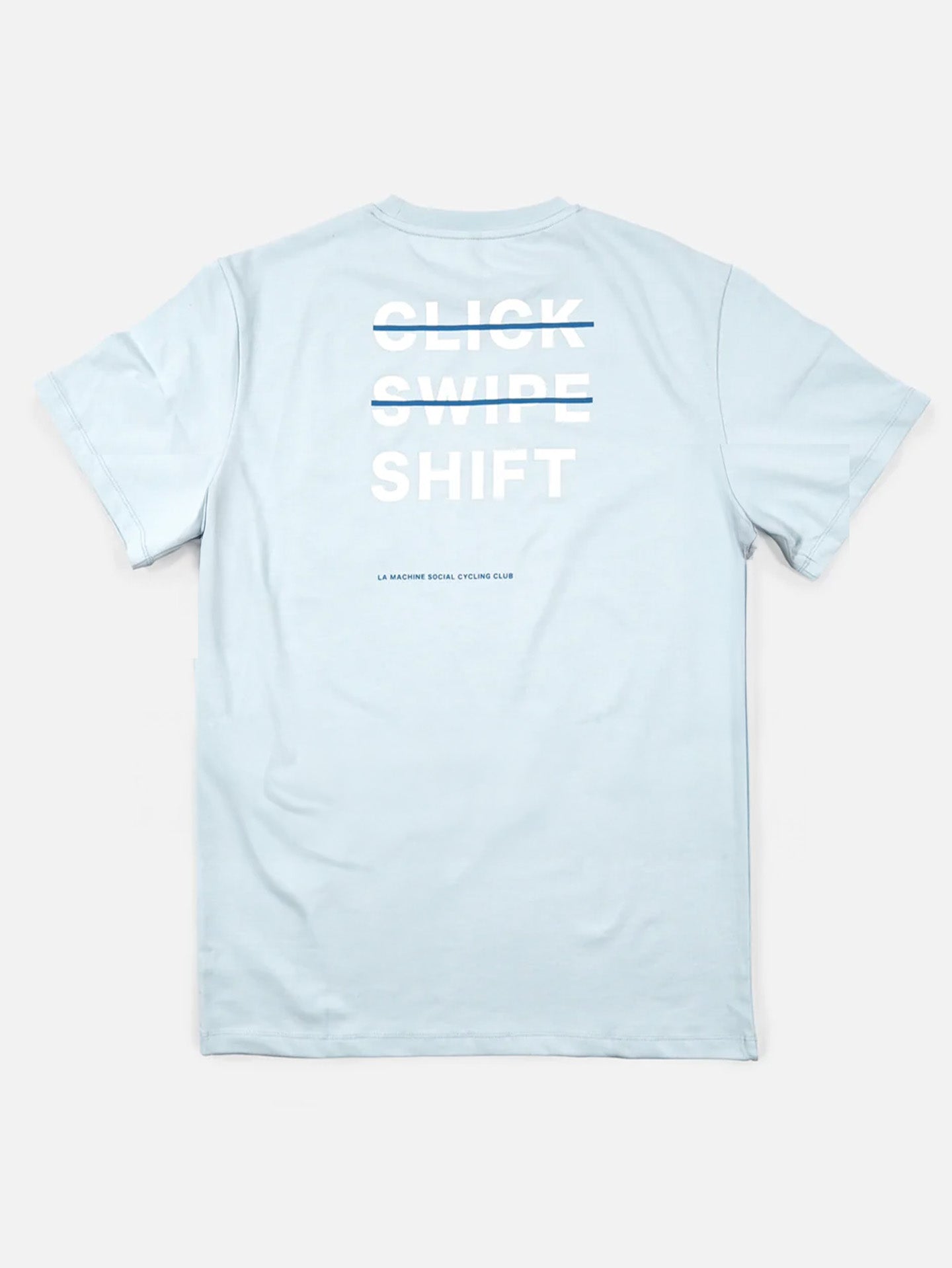A light blue, heavy cotton Loose Fit T-shirt from La Machine Cycle Club with a bold white CLICK, SWIPE (crossed out), and SHIFT print on the back. Below, small text reads: Social Cycling Club.