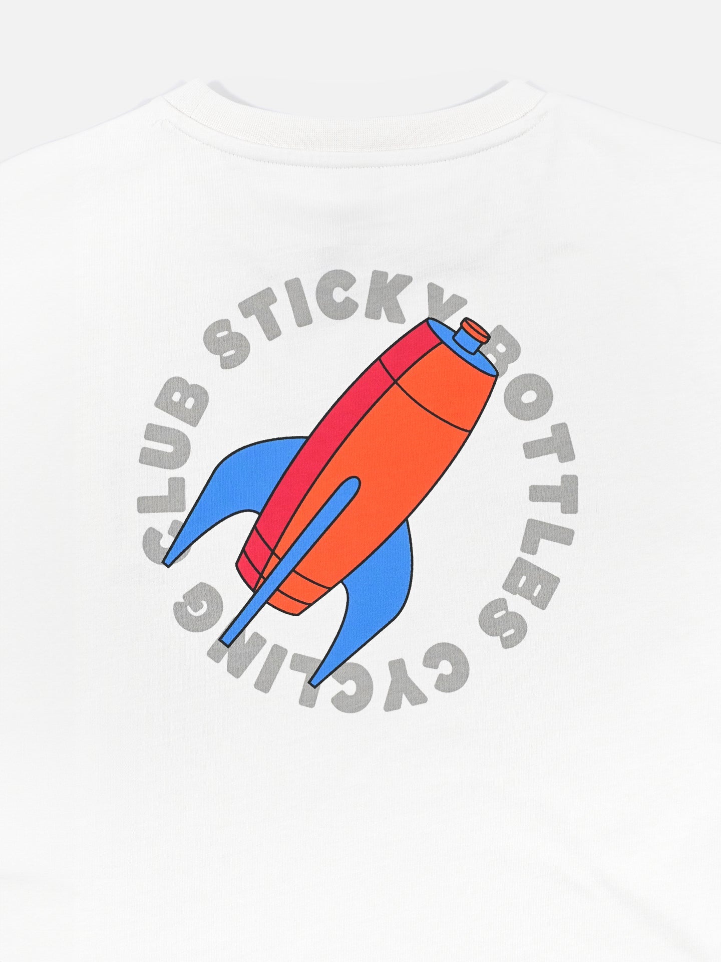 The Sticky Bottles - Loose Fit T-shirt by La Machine Cycle Club features a large red and blue rocket illustration on white, framed by curved gray Sticky Bottles Cycling Club text—a bold back print on heavy cotton.