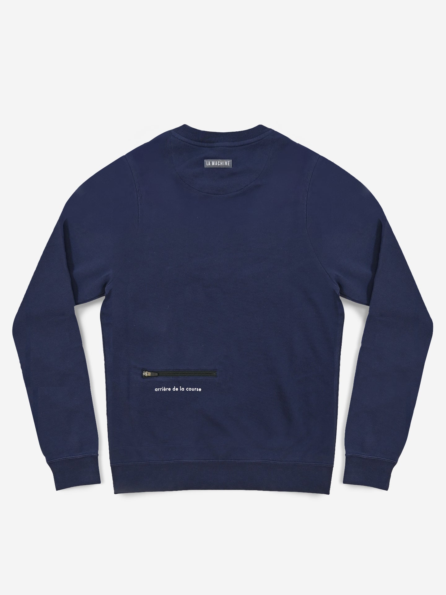 The La Machine Cycle Club Tête de la Course sweatshirt is a navy blue, 100% cotton mens crewneck with a small black horizontal zipper pocket and white critère de la course text near the lower right side, shown laid flat on a white background.