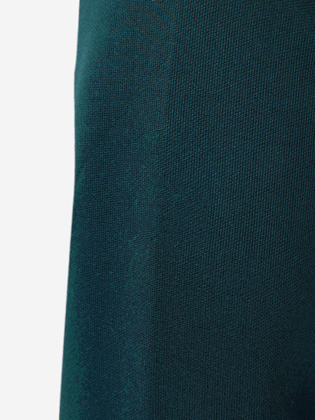 Close-up of the Atlantic Deep fabric from La Machine Cycle Club’s Food of Champions Track Jacket, showing a subtle texture, smooth tight weave, and a vertical seam for a tailored fit.