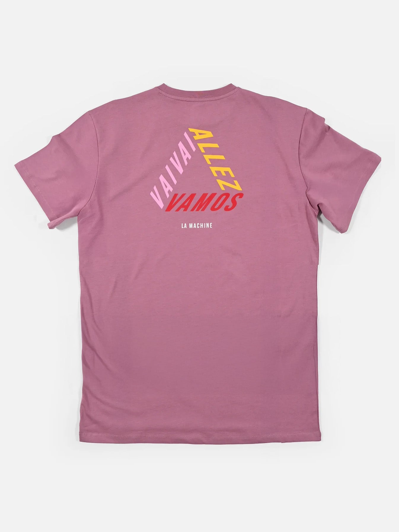 The Vai Allez Vamos - Loose Fit T-shirt by La Machine Cycle Club is a pink unisex cycling tee, featuring VAI VAI, ALLEZ, and VAMOS in bold on the back with subtle LA MACHINE script below. Made from comfortable heavy cotton.