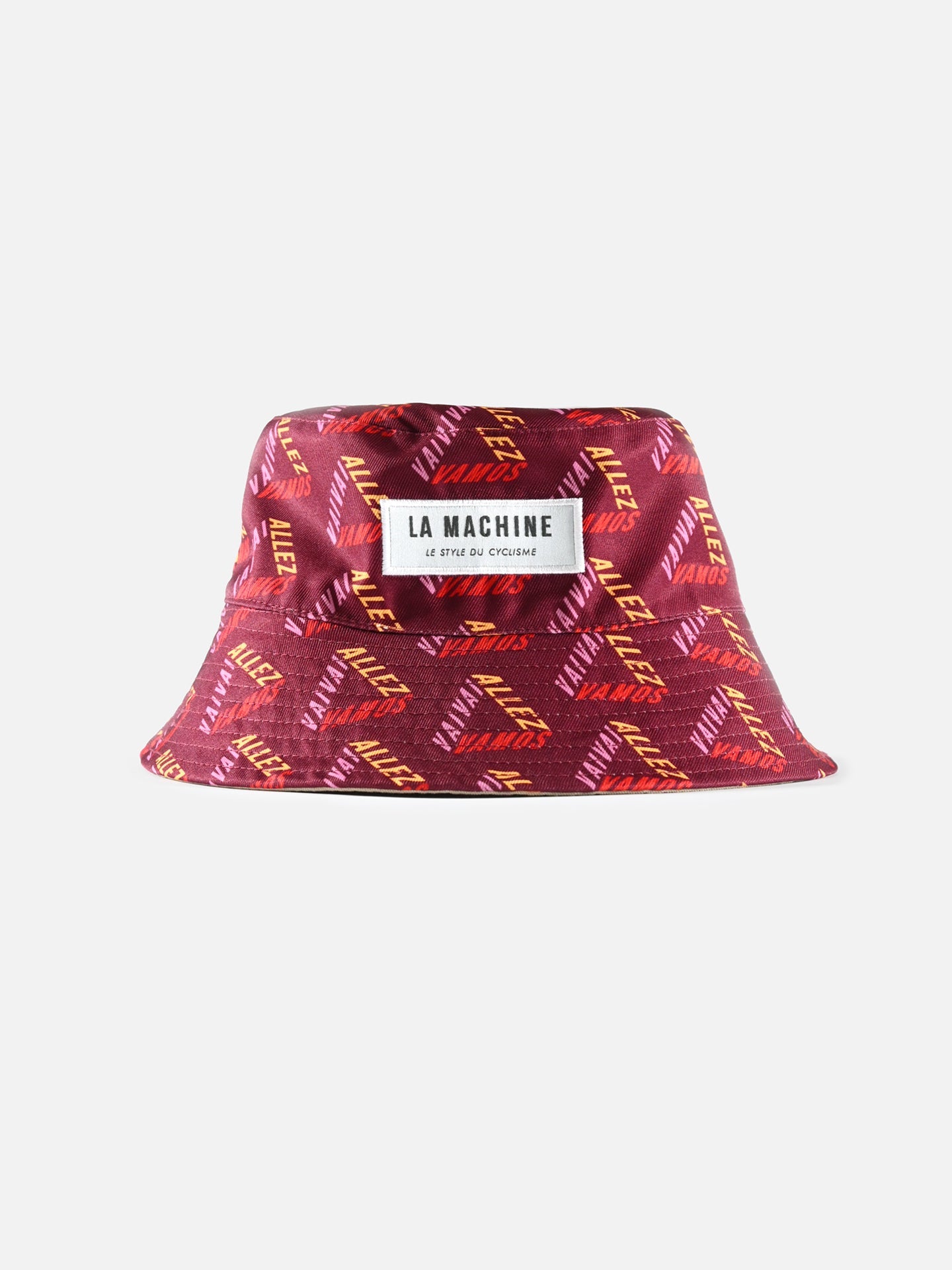 The La Machine - Reversible Bucket Hat by La Machine Cycle Club features maroon fabric, orange/yellow diagonal “ALLEZ” text, a small “VANS” logo, plus a white patch labeled “LA MACHINE, LE STYLE DU CYCLISME”—a stylish cycling hat tribute.