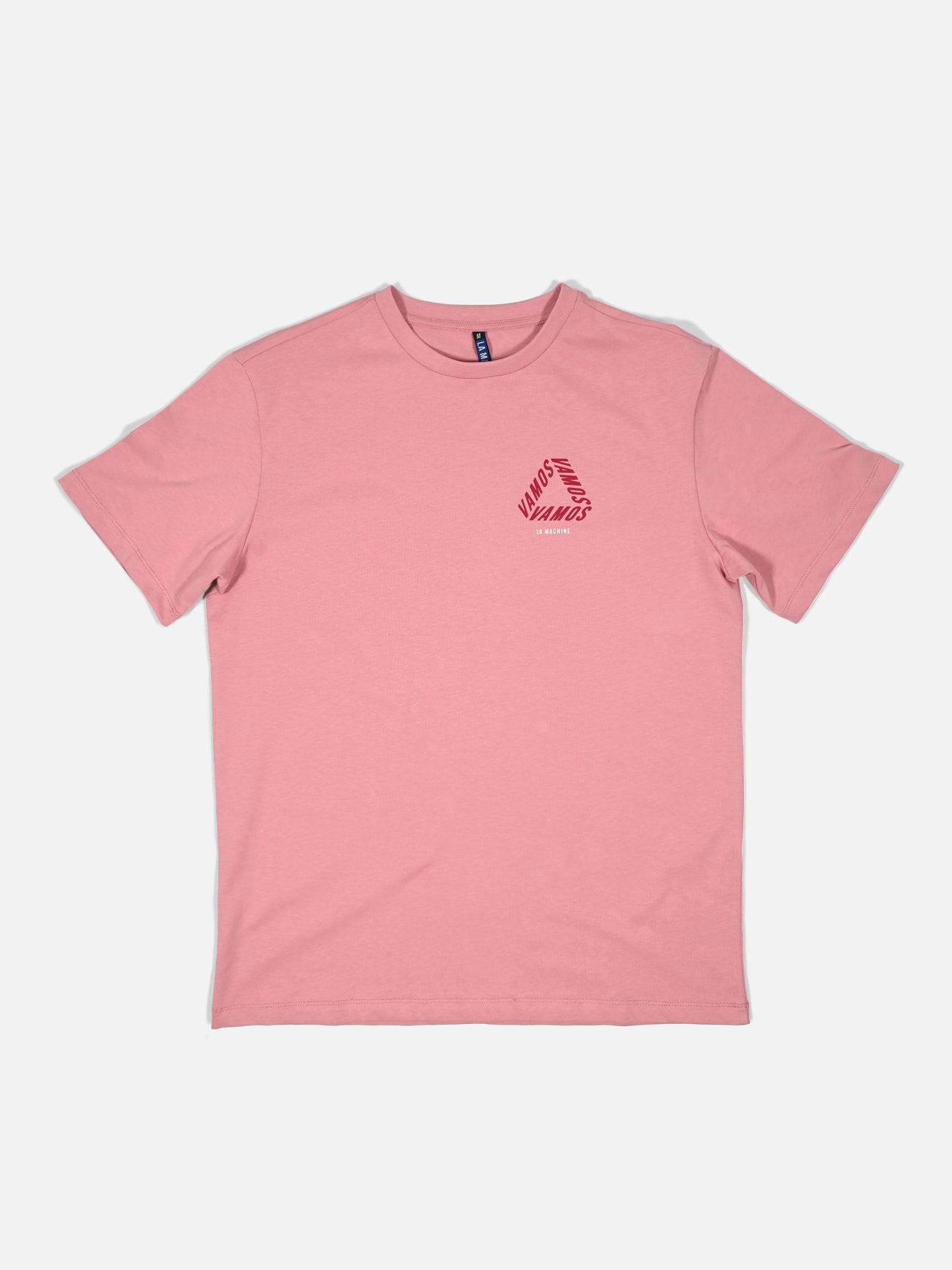 The Vamos - Loose Fit - Vuelta a España T-shirt by La Machine Cycle Club is a plain pink, short-sleeve cycling tee with a red circular UNVRS logo on the left chest, inspired by Spanish cycling style and shown on a white background.