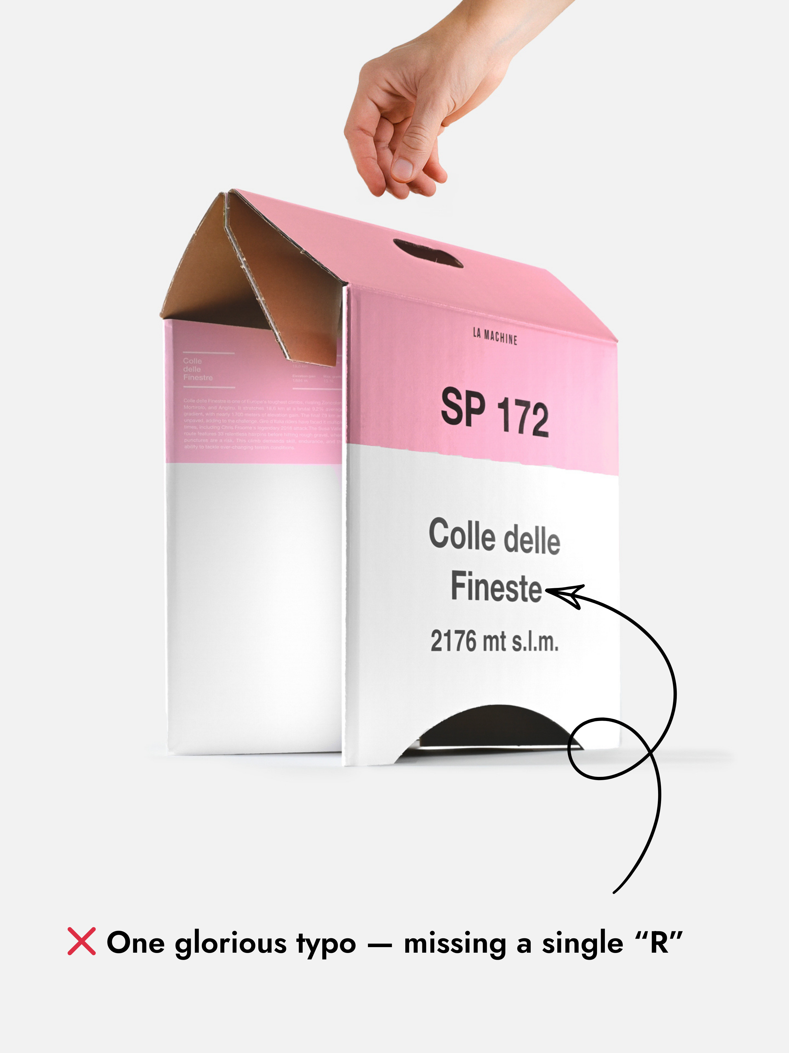 A hand holds a La Machine Cycle Club Colle delle Finestre - 2-in-1 Stool & Sidetable (Misprint Edition); a curved arrow highlights the missing R in “Finestre” on the pink and white box, showcasing this unique cycling memorabilia.