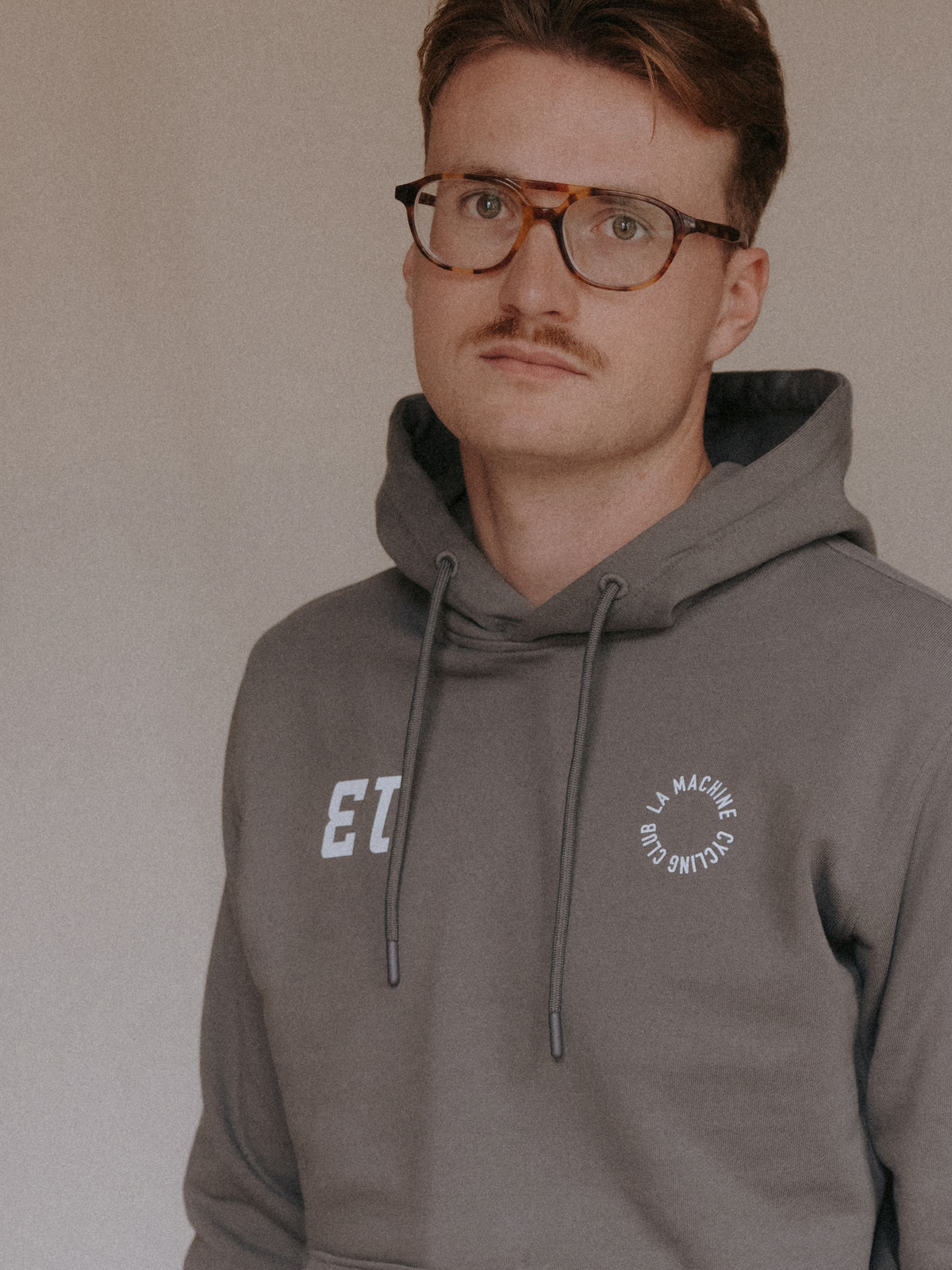 The Vamos Hoodie in asphalt grey by La Machine, folded.