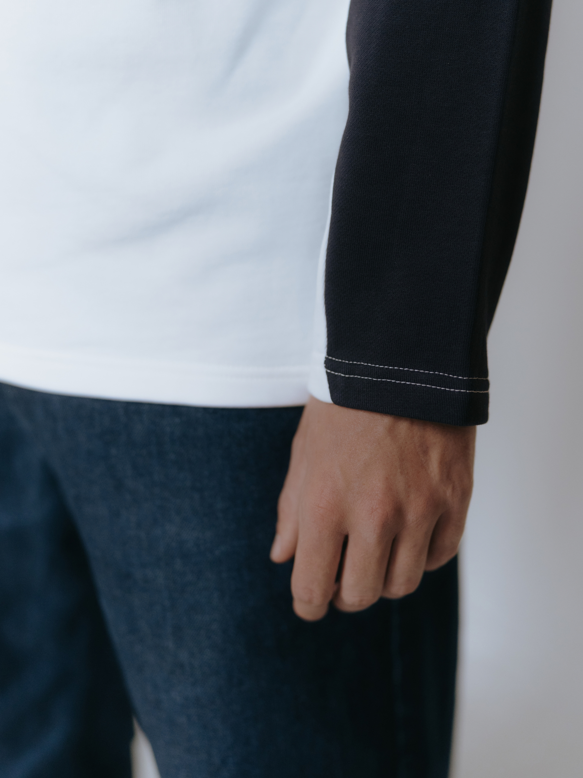 Close-up of the Talentless print on the dark navy blue and off white sweatshirt.
