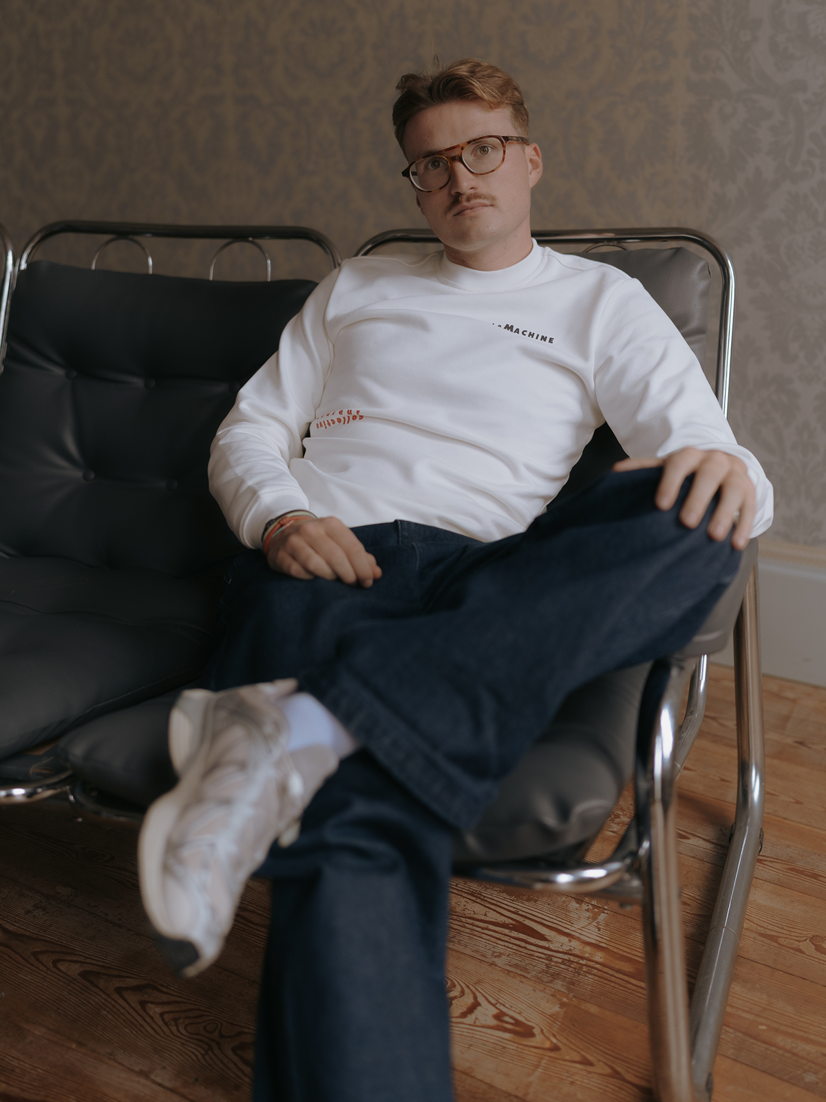Close-up of the print on the Crémant for Coureurs Sweatshirt in off white by La Machine.