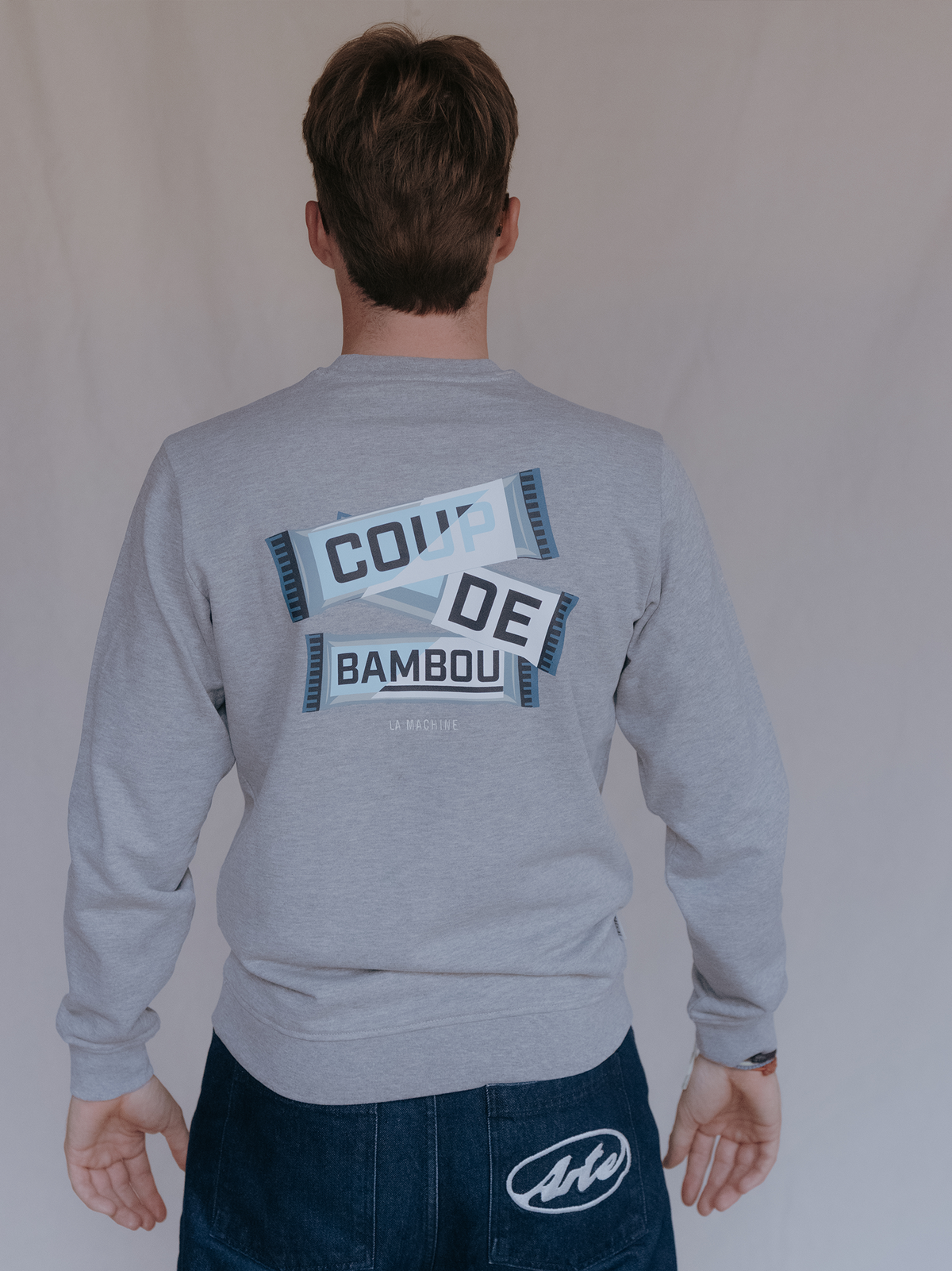 Close-up of the fabric and stitching on the Coup de Bambou Sweatshirt in melange grey by La Machine.
