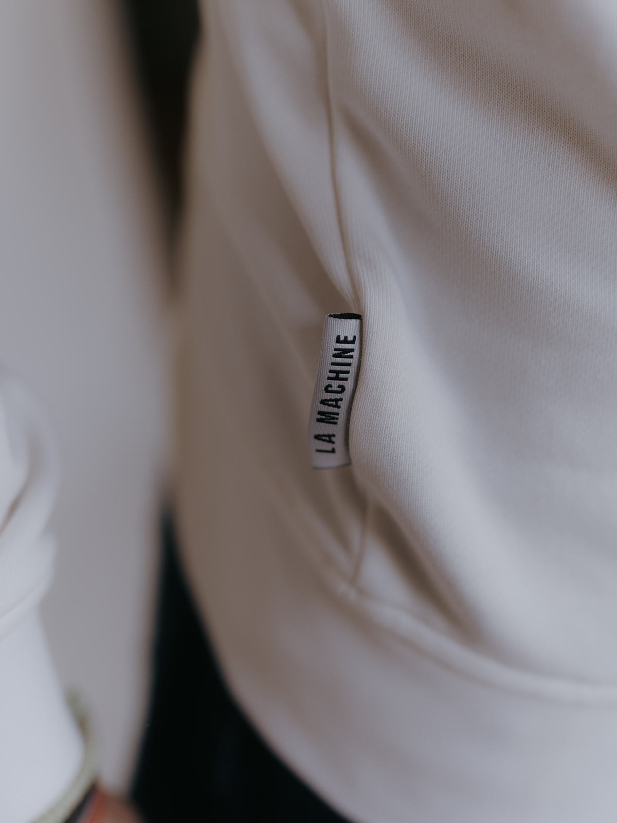 Crémant for Coureurs Sweatshirt in off white by La Machine, folded.