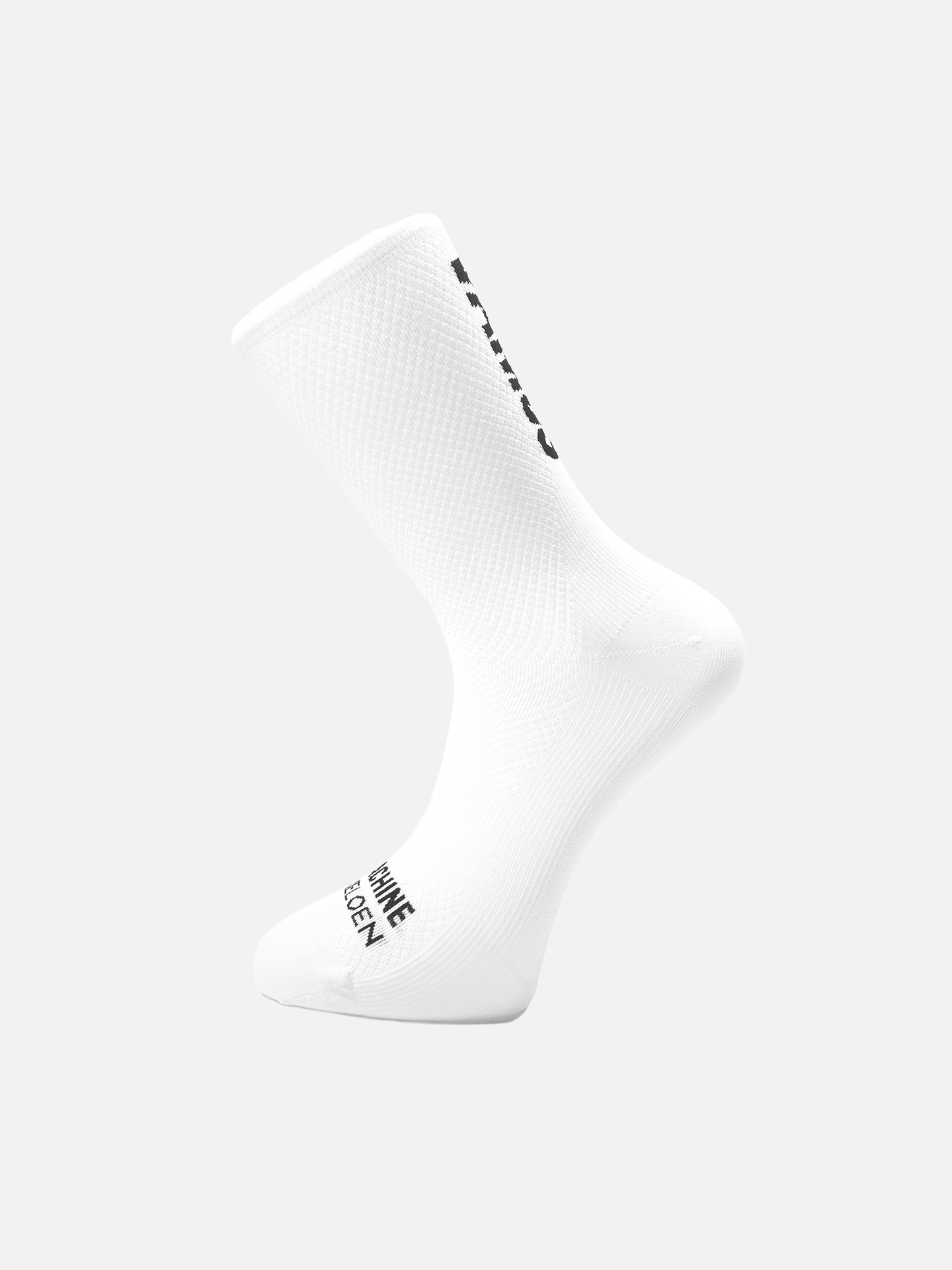 The Vamos - Cycling Socks by La Machine Cycle Club is shown as a single all-white sock on a light background, featuring black side and toe text, ribbed texture, and seamless toe for optimal elastic fit.