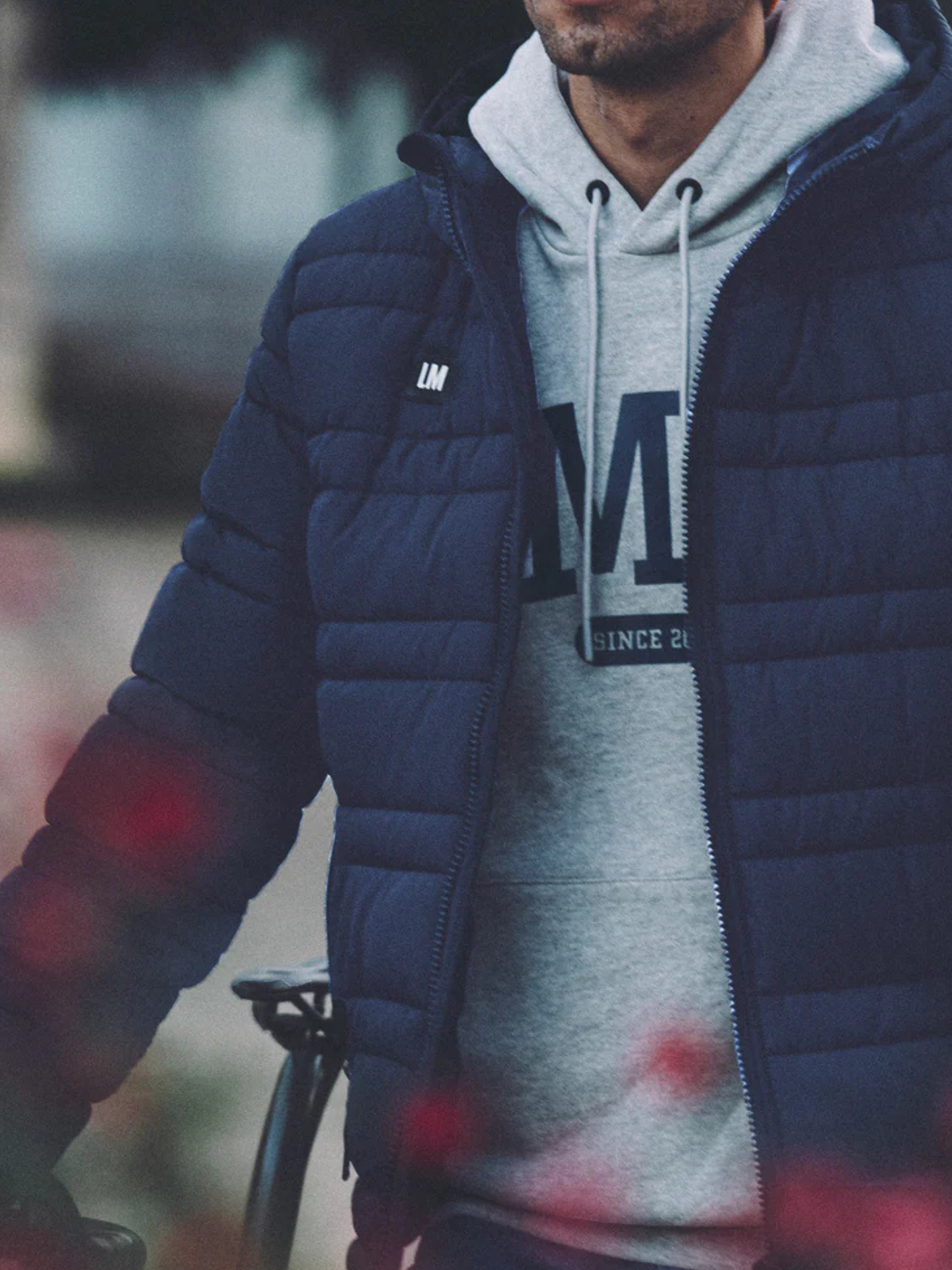 Additional view of the Beyond the bike - Padded Jacket - Blue by La Machine Cycle Club.