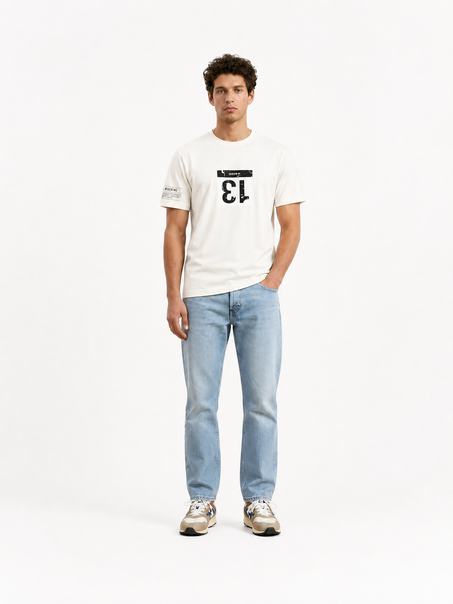A model wearing the Bib Number 13 - T-shirt - Off White by La Machine Cycle Club.