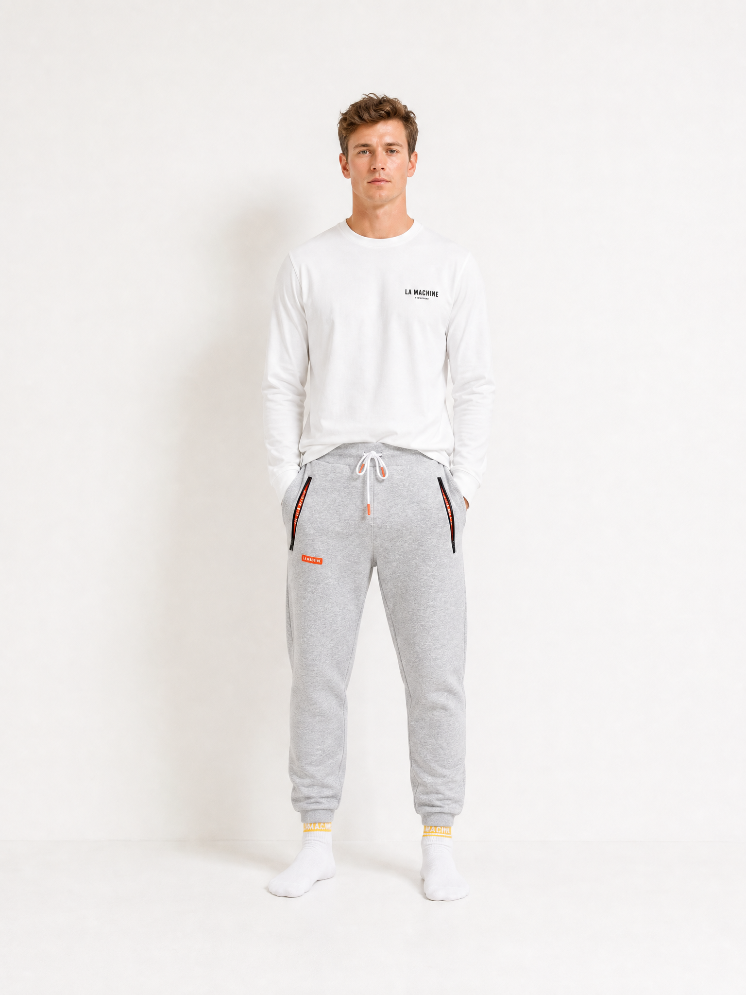 A model wearing the De Koersbroek - Sweatpants by La Machine Cycle Club.