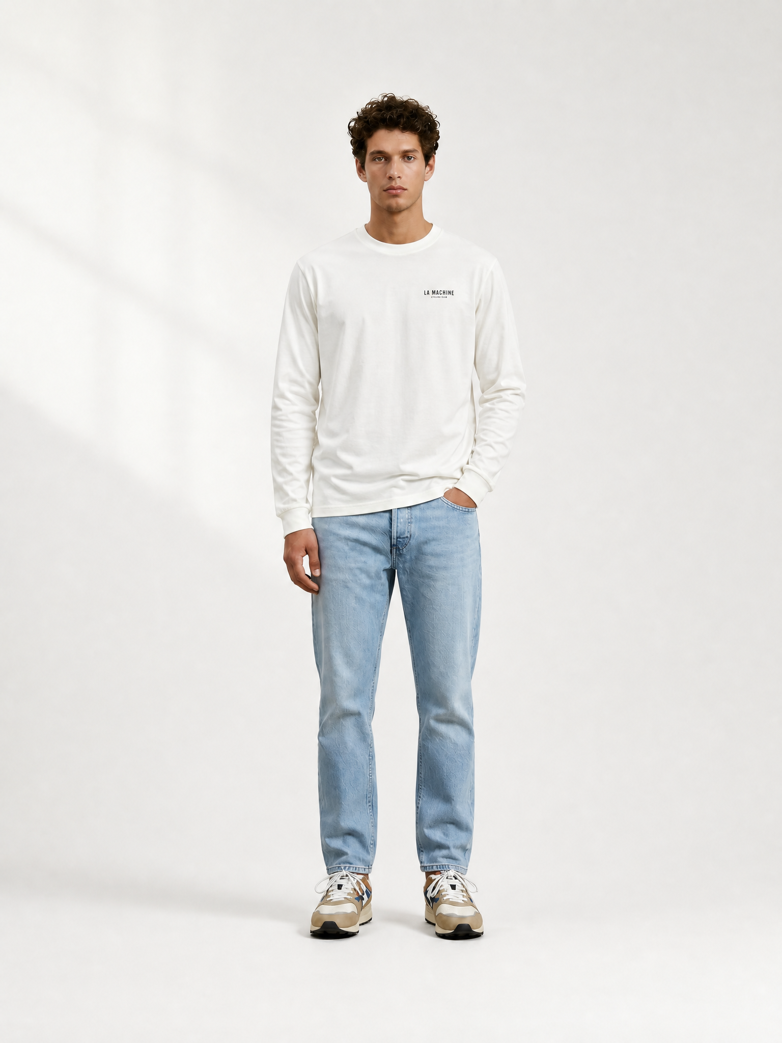 A model wearing the Directeur Sportif - Longsleeve by La Machine Cycle Club.