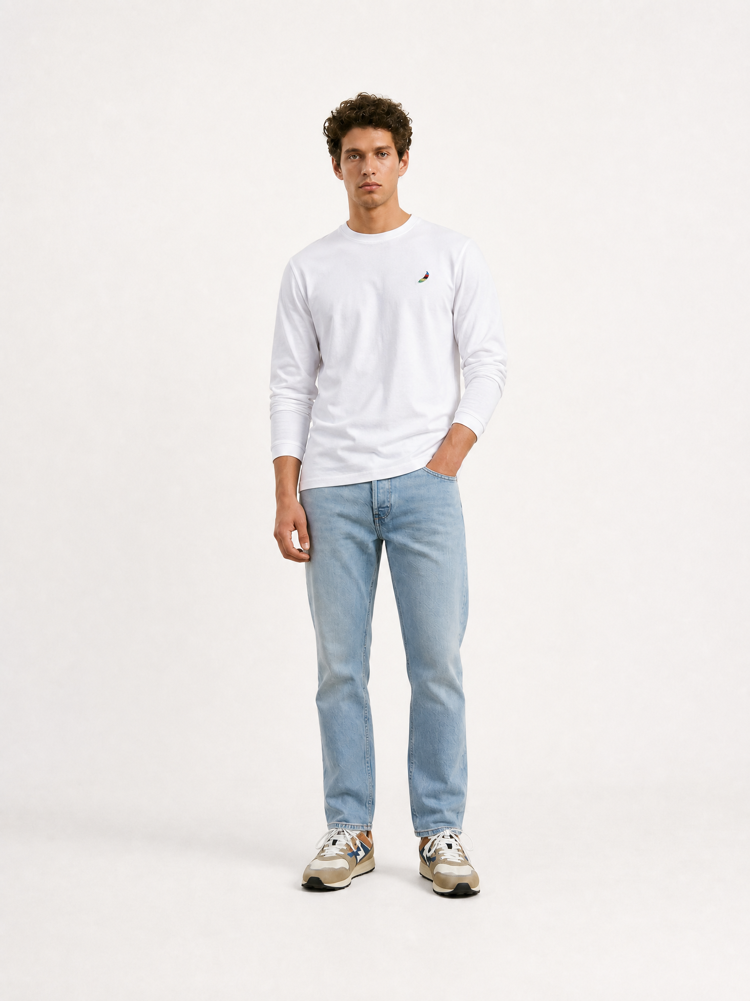 A model wearing the Food of Champions - Long Sleeve T-shirt - White by La Machine Cycle Club.