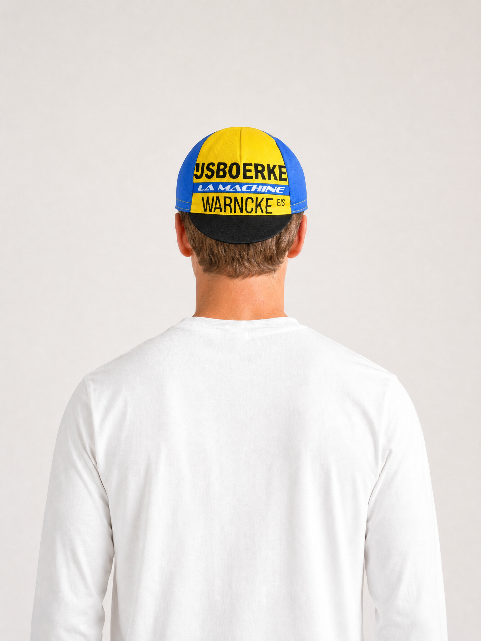 A model wearing the IJsboerke - Cycling Cap by La Machine Cycle Club.