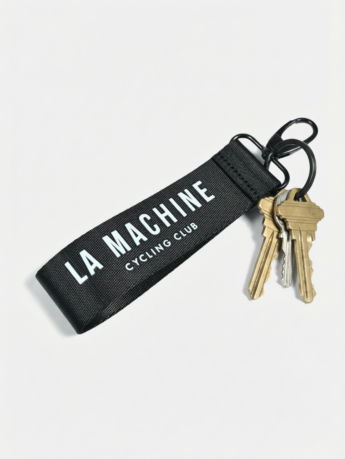 Detail view of the La Machine Cycling Club - Keychain by La Machine Cycle Club.