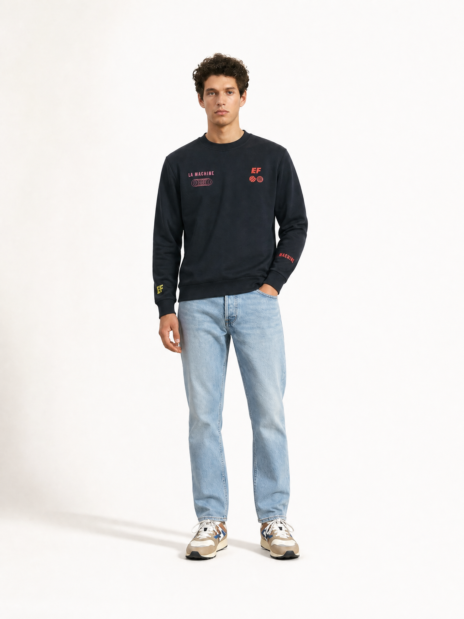 A model wearing the La Machine X EF Pro Cycling - Dimension - Sweatshirt - Dark Navy Blue by La Machine Cycle Club.
