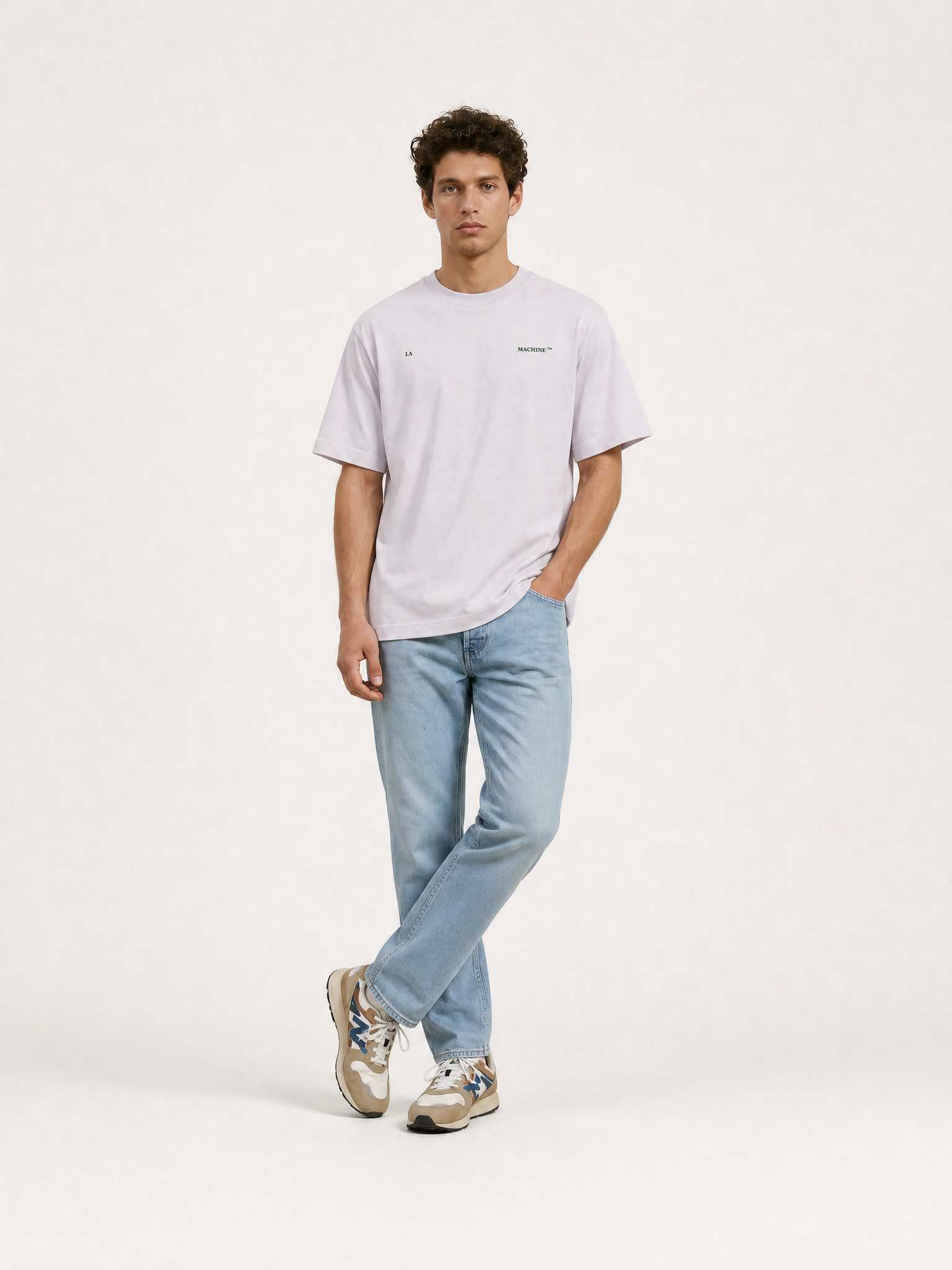 A model wearing the Made in Mons-en-PévÚle - Loose Fit - T-shirt by La Machine Cycle Club.